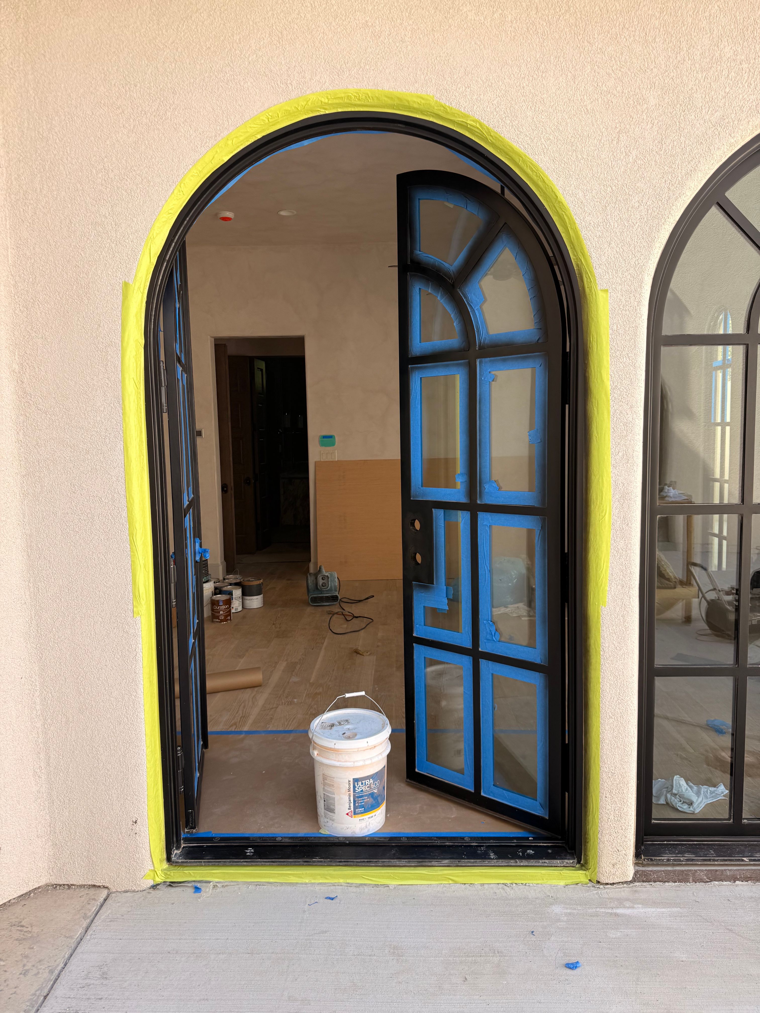 Arched Black Metal French Door Installation and Finishing in Fort Worth by Solara Custom Living