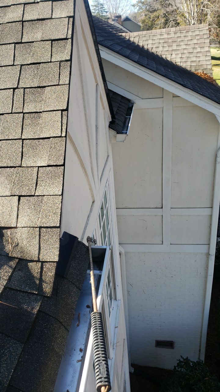 Sara Gutter cleanout using water by Power Wash Masters LLC