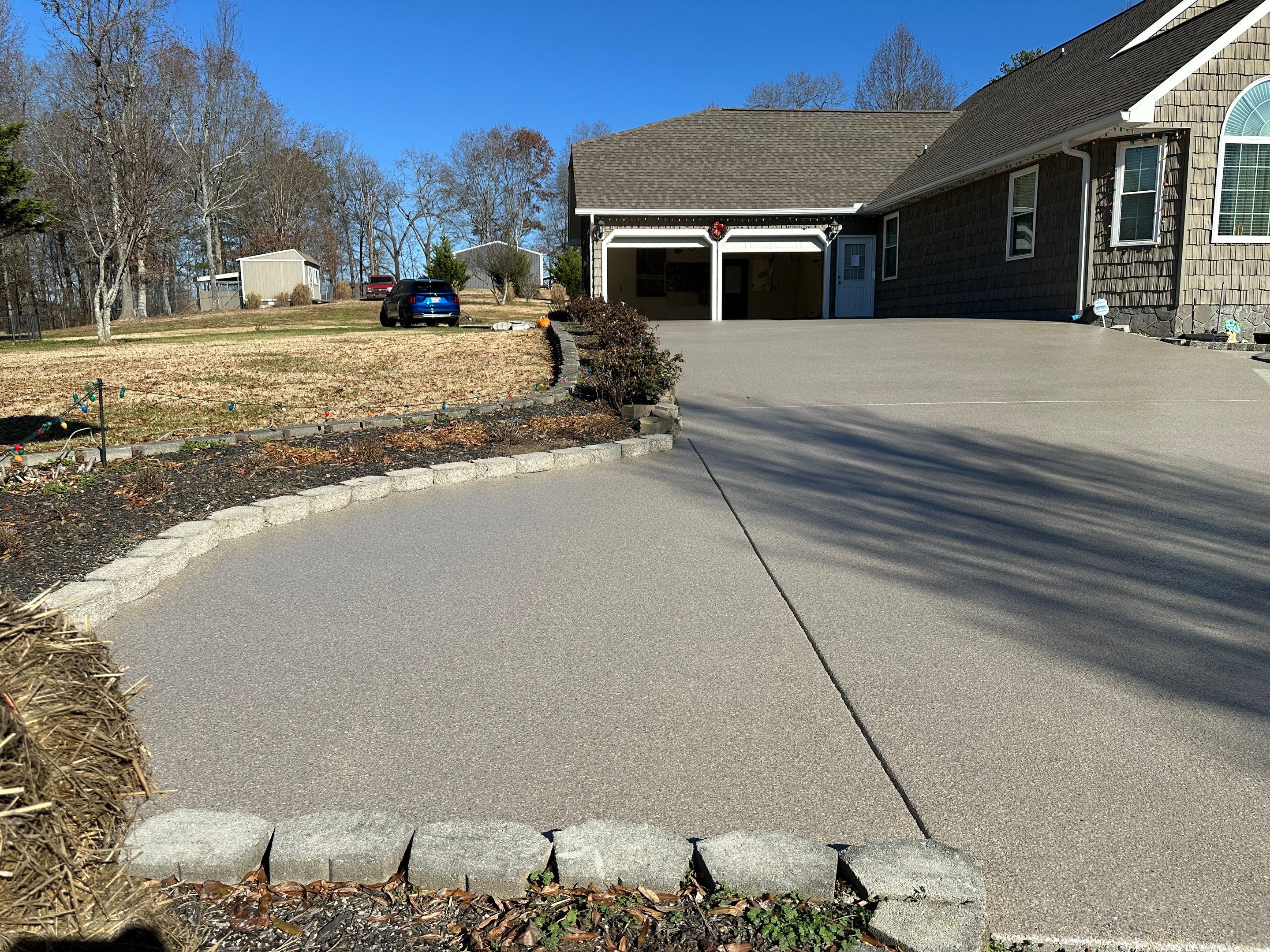 Driveway using Obsidian by Elite Floor Solutions
