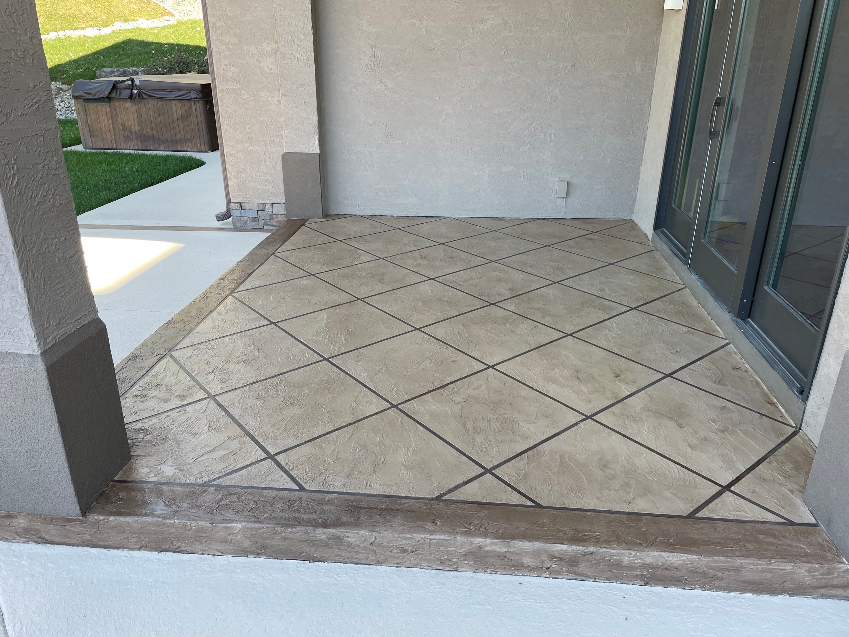 Lake Lotawana -- Front Walkway and Back Patio Tuscan Overlay by Big Red Decorative Concrete, LLC