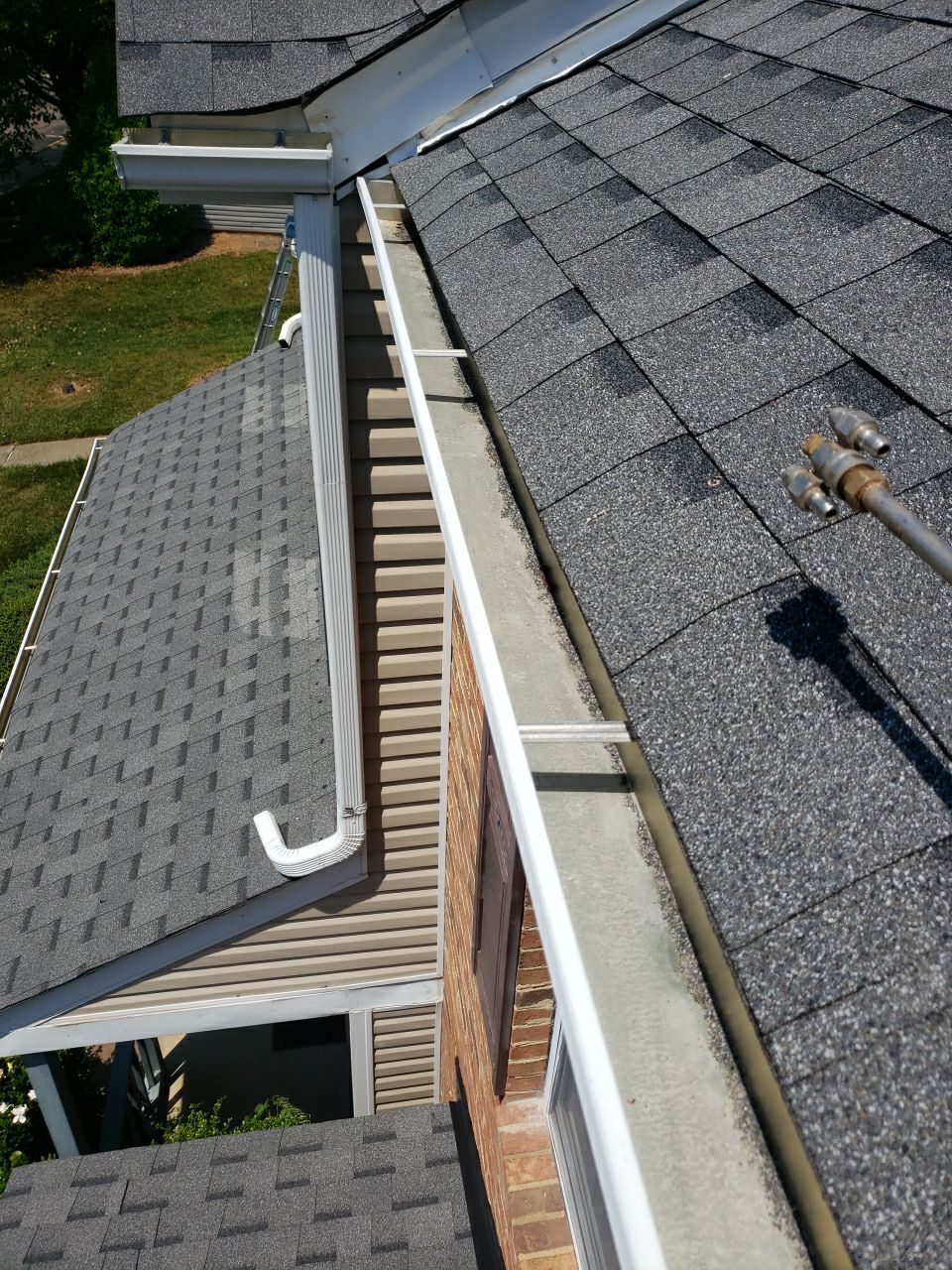 Gutter Cleaning using water by Power Wash Masters LLC