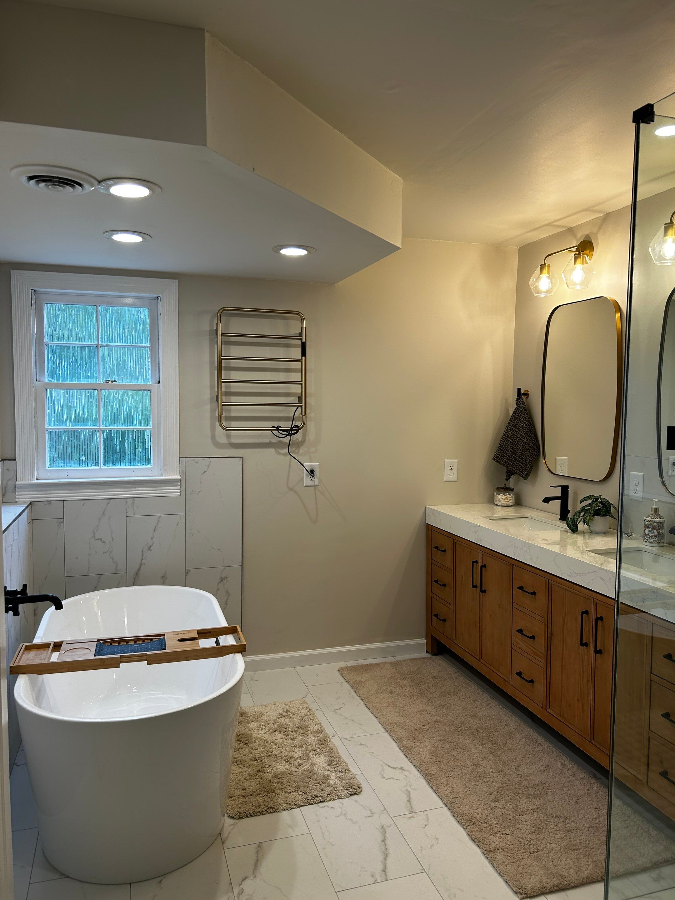 Spa like bathroom by Footprints Bath and Tile of East Atlanta