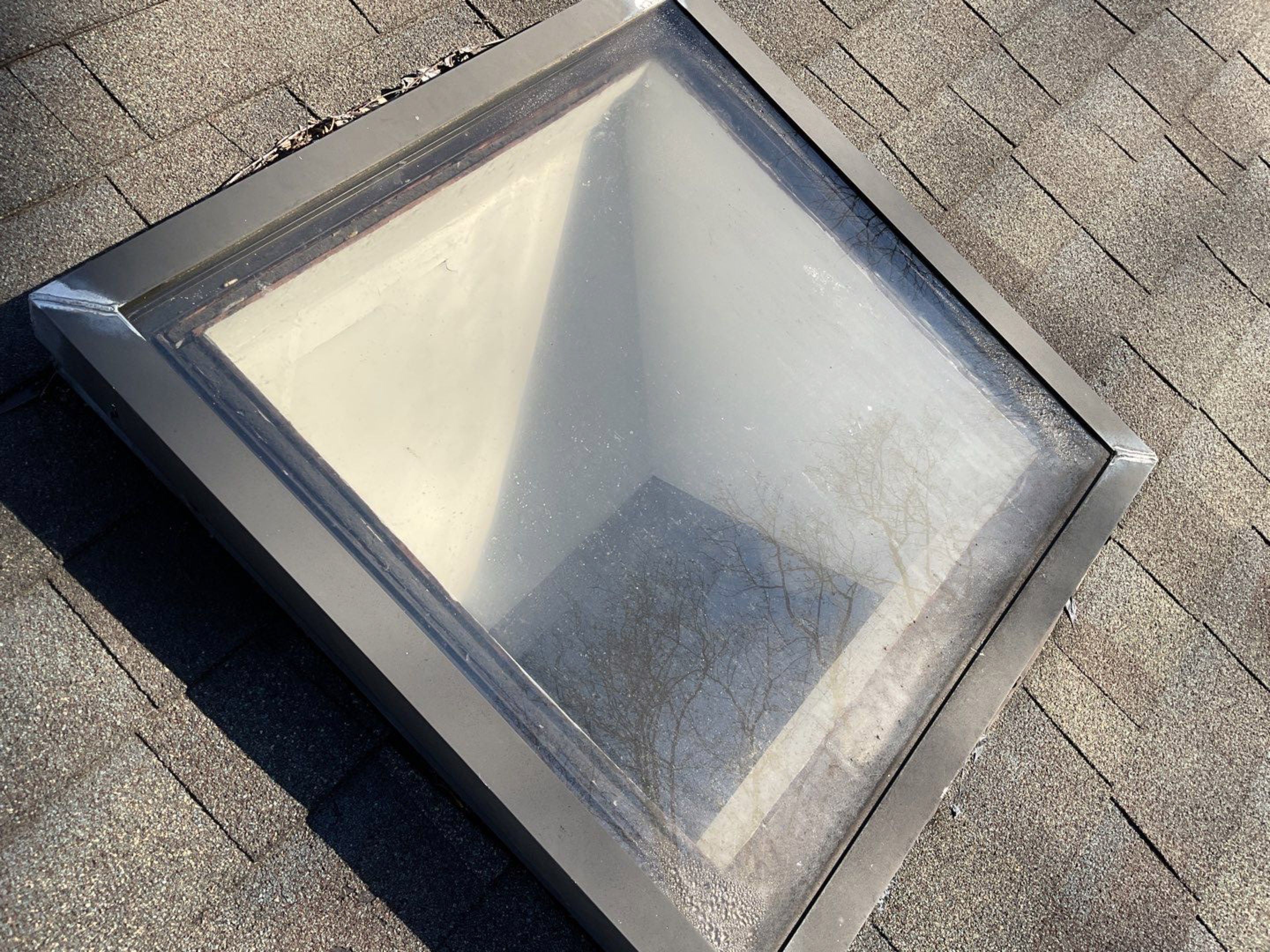Install new shingles and new skylights  by Alpha Design Services