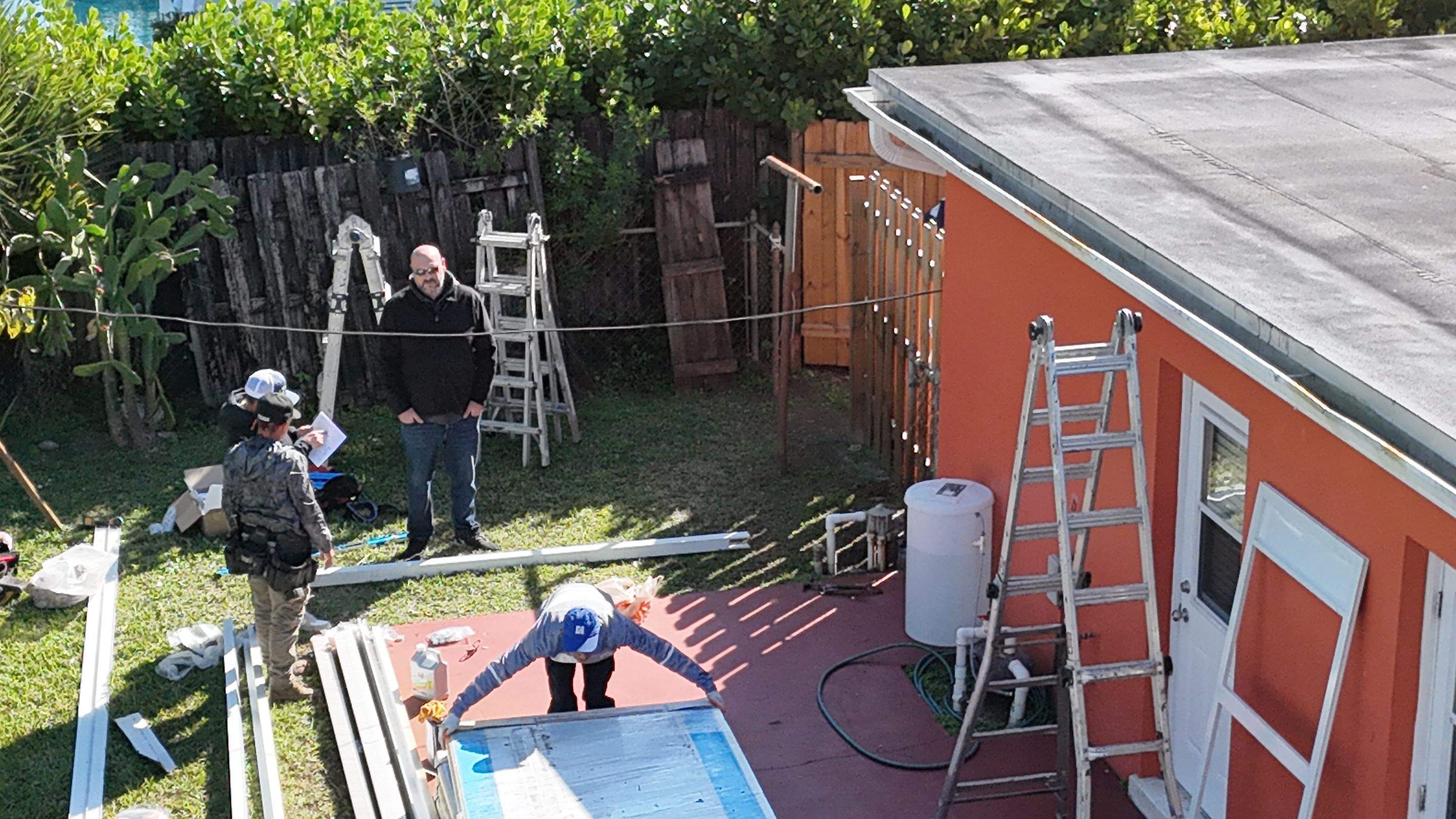 Insulated Screen Enclosure and Wood Tile Deck Installation in Plantation by Aastro Roofing