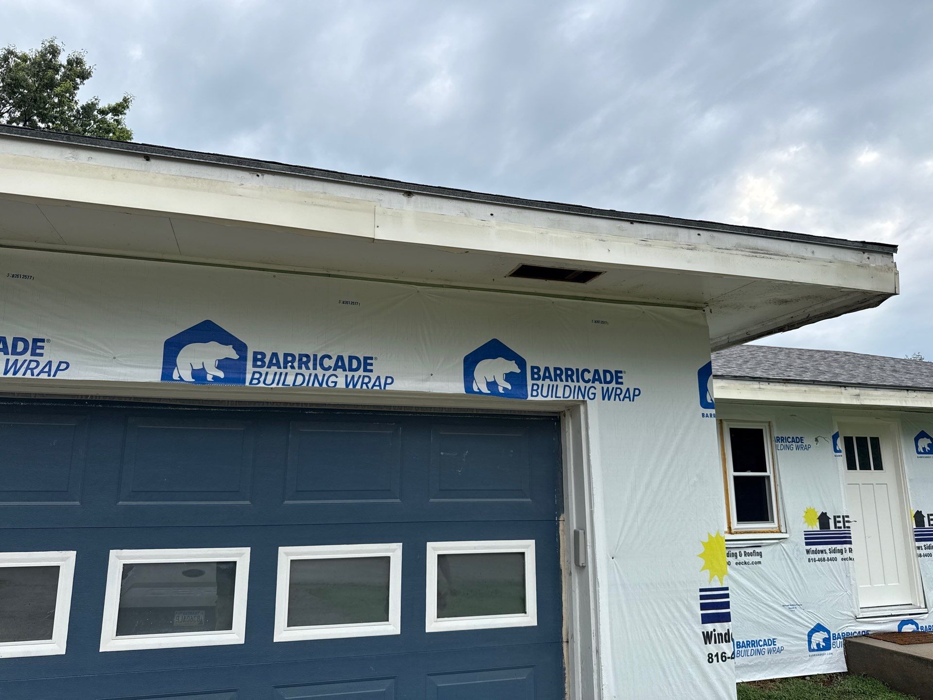 Indigo Board and Batten Siding and Window Replacement in Smithville by EEC Windows, Siding & Roofing