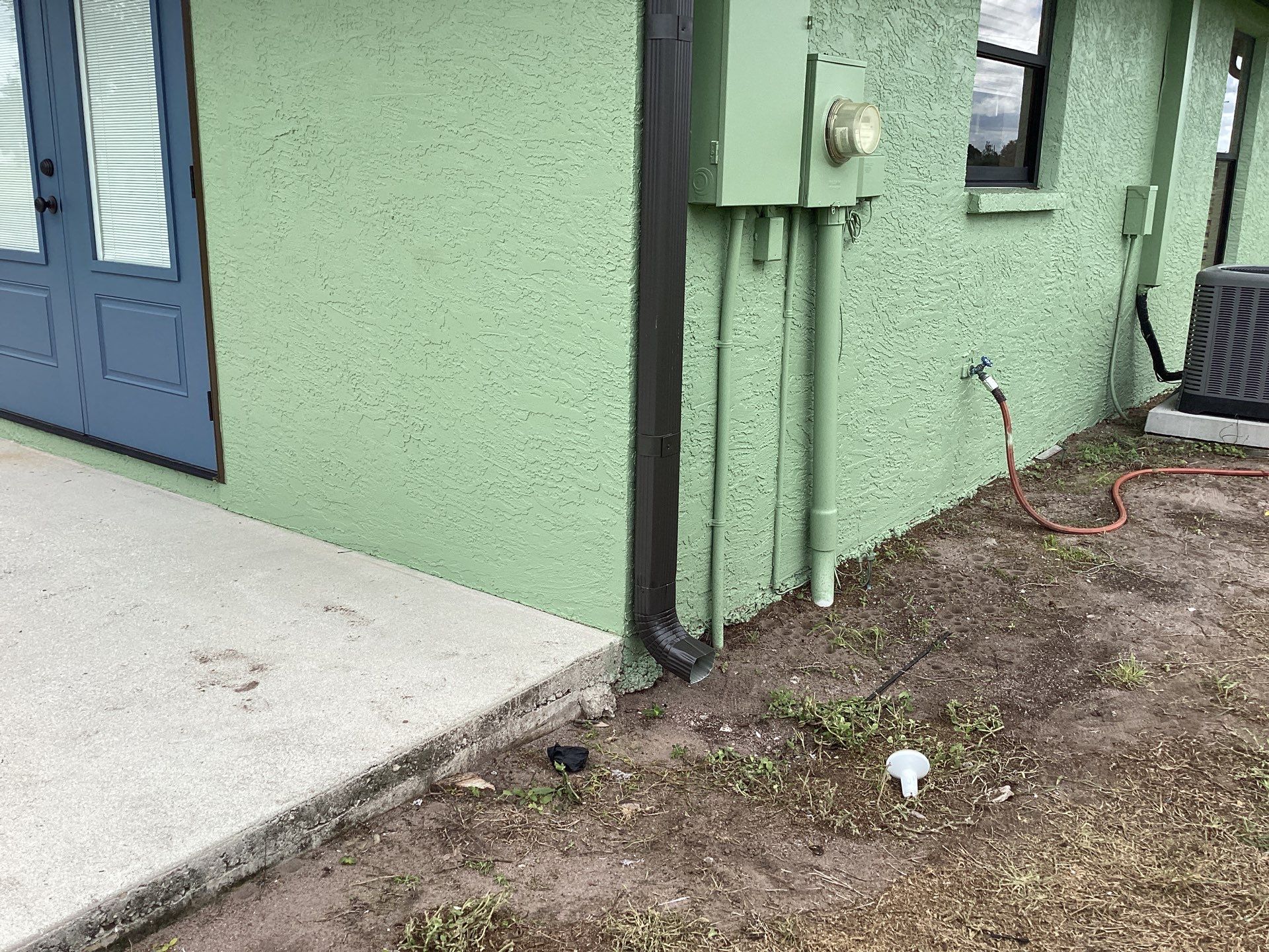 Musket brown downspouts with 6-inch K-Style gutter installation in Myakka City, FL by Gutter Professors