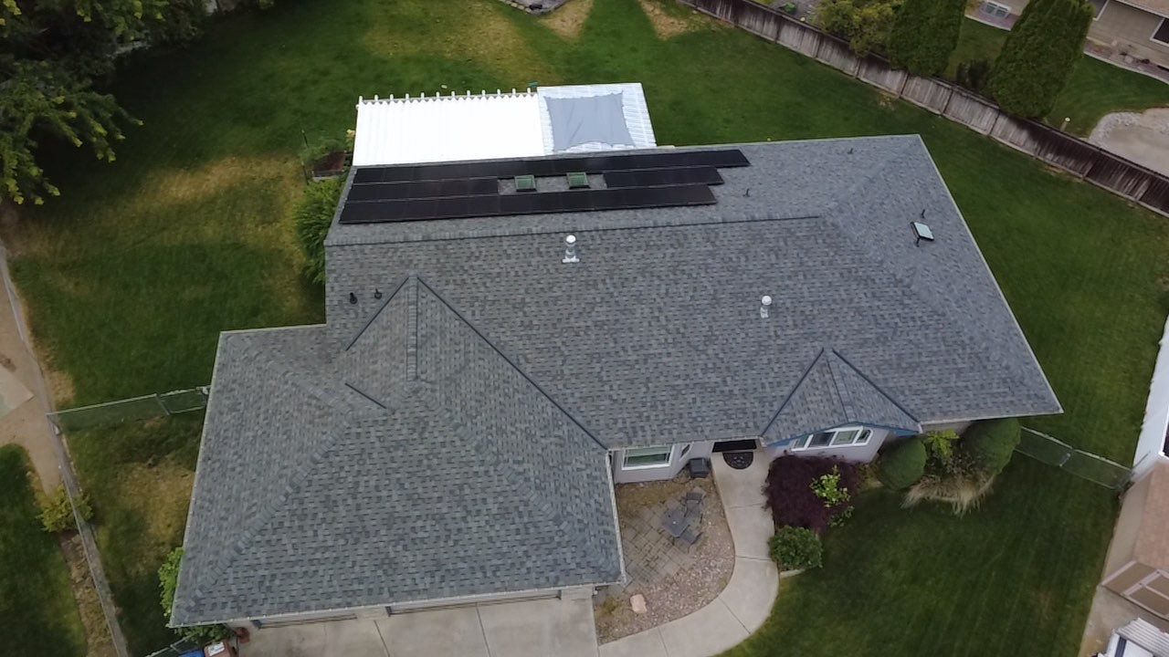 Spokane Residential Roof Replacement With Solar Panel and Skylight Integration N Portsmouth Ct Spokane, WA 99208  The Denali System - Certainteed Landmark® Shingle - Granite Gray by Alpine Roofing