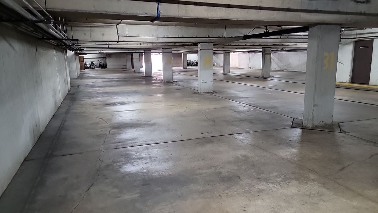 Parking garage using Hot water by Northern Power Washing LLC.
