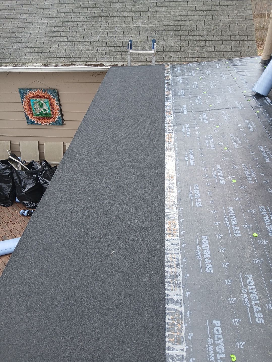 Flat Roof Installation and Chimney Counterflashing Installation by Eagle Eye Roofing