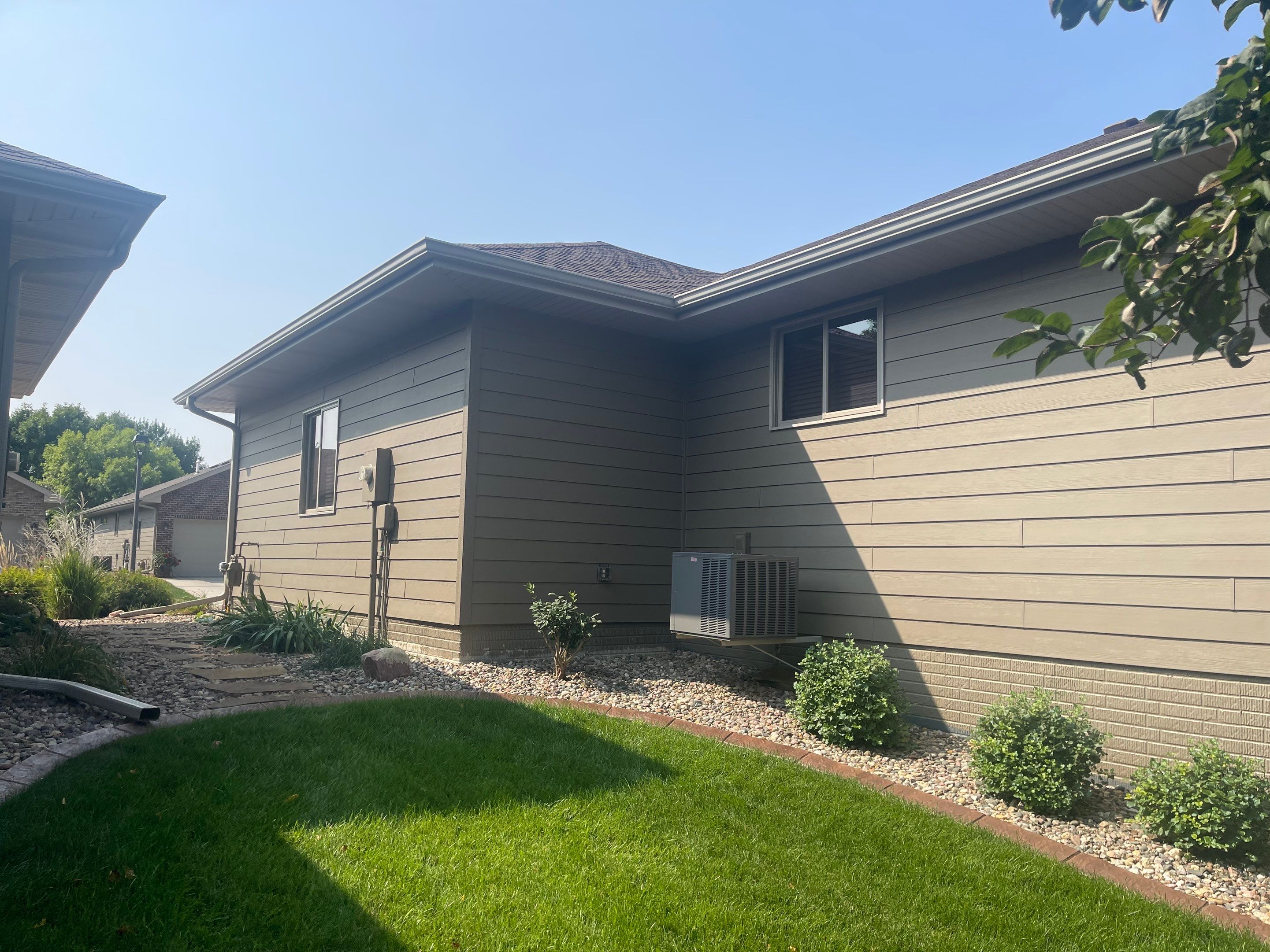 Residential Exterior Siding and Trim Painting in Sioux Falls by Select Painting, Coatings & Garage Cabinets