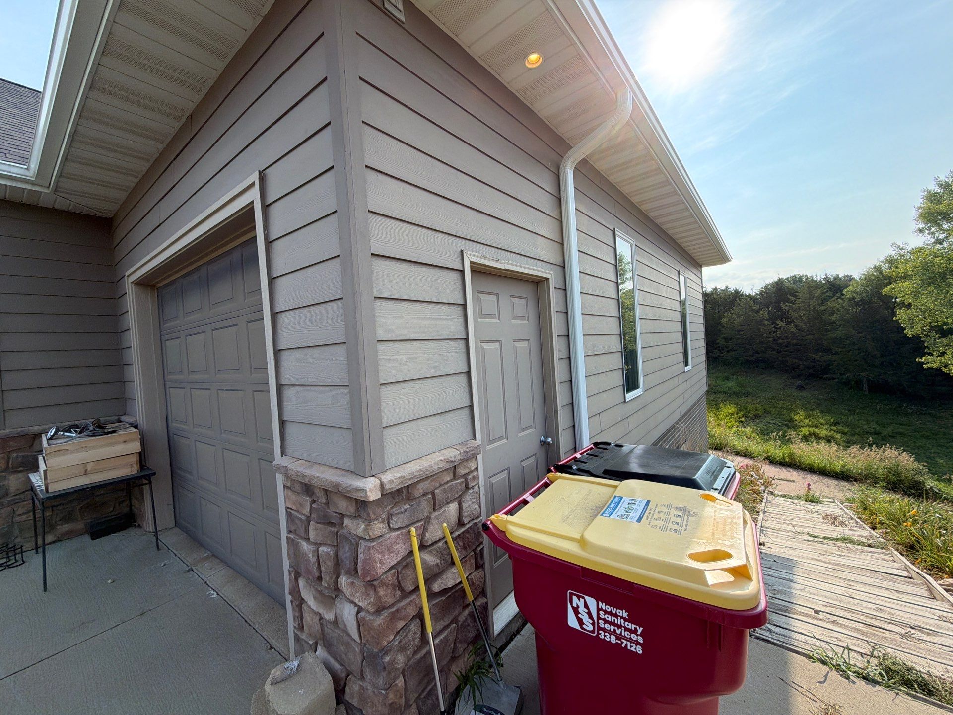 Sioux Falls Residential Exterior Painting and Siding Refresh by Select Painting, Coatings & Garage Cabinets