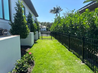 Aluminum Fence Installation using Black 3 Rail Aluminum Fence