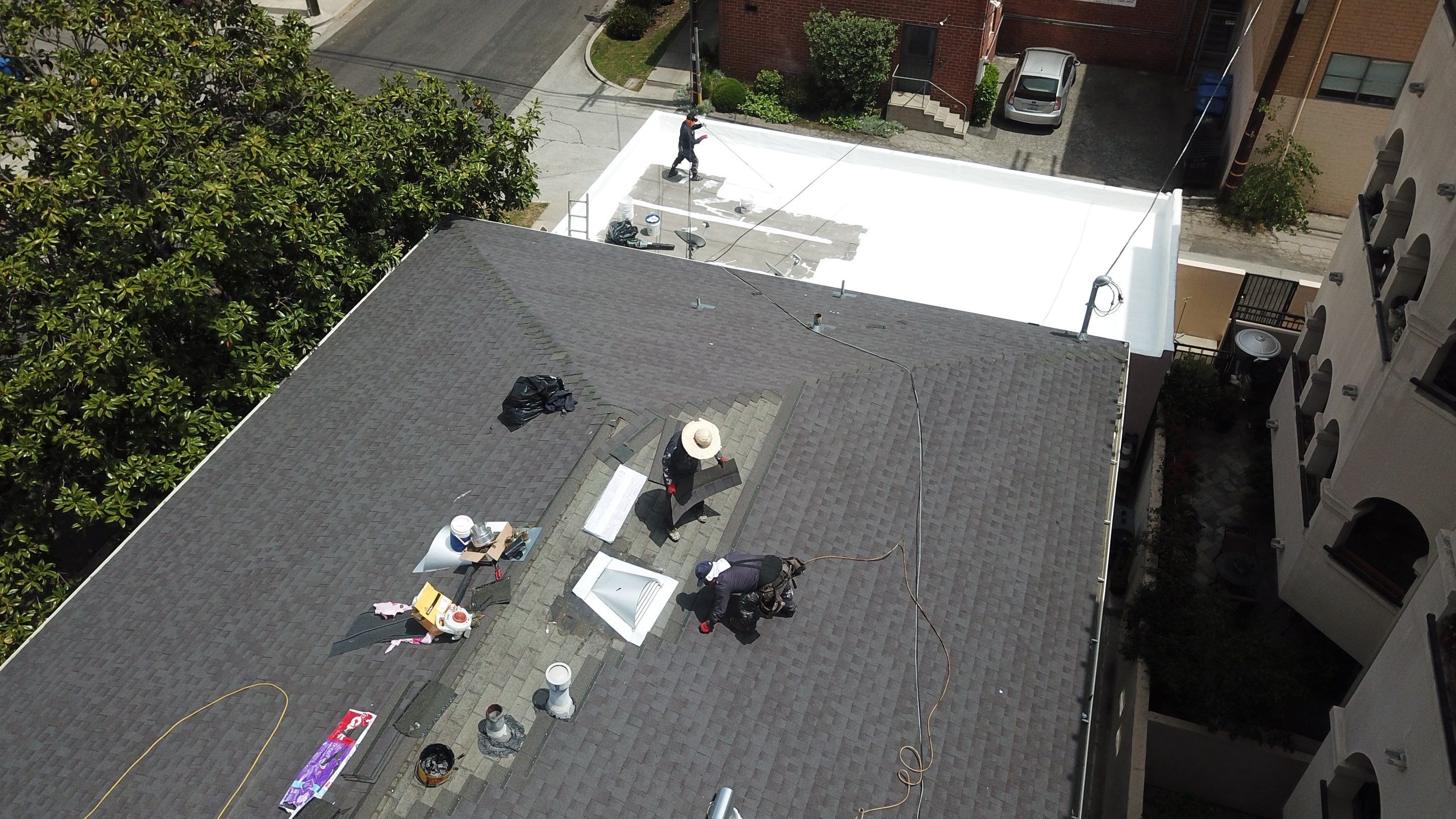 Apartment Building 2nd Layer Installation &Silicone coating by Hull Brothers Roofing