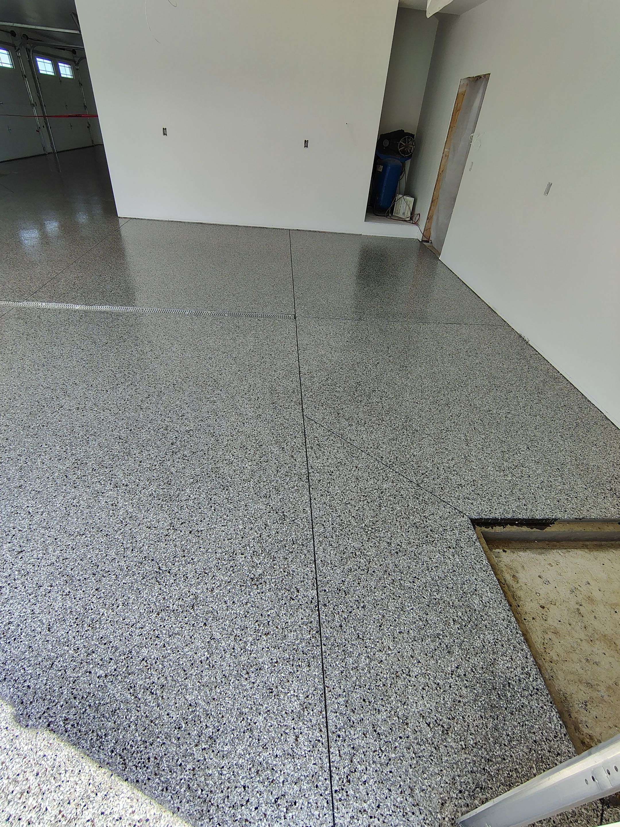 Custom Garage and Basement Epoxy Floor Coating in Menno by Select Painting, Coatings & Garage Cabinets