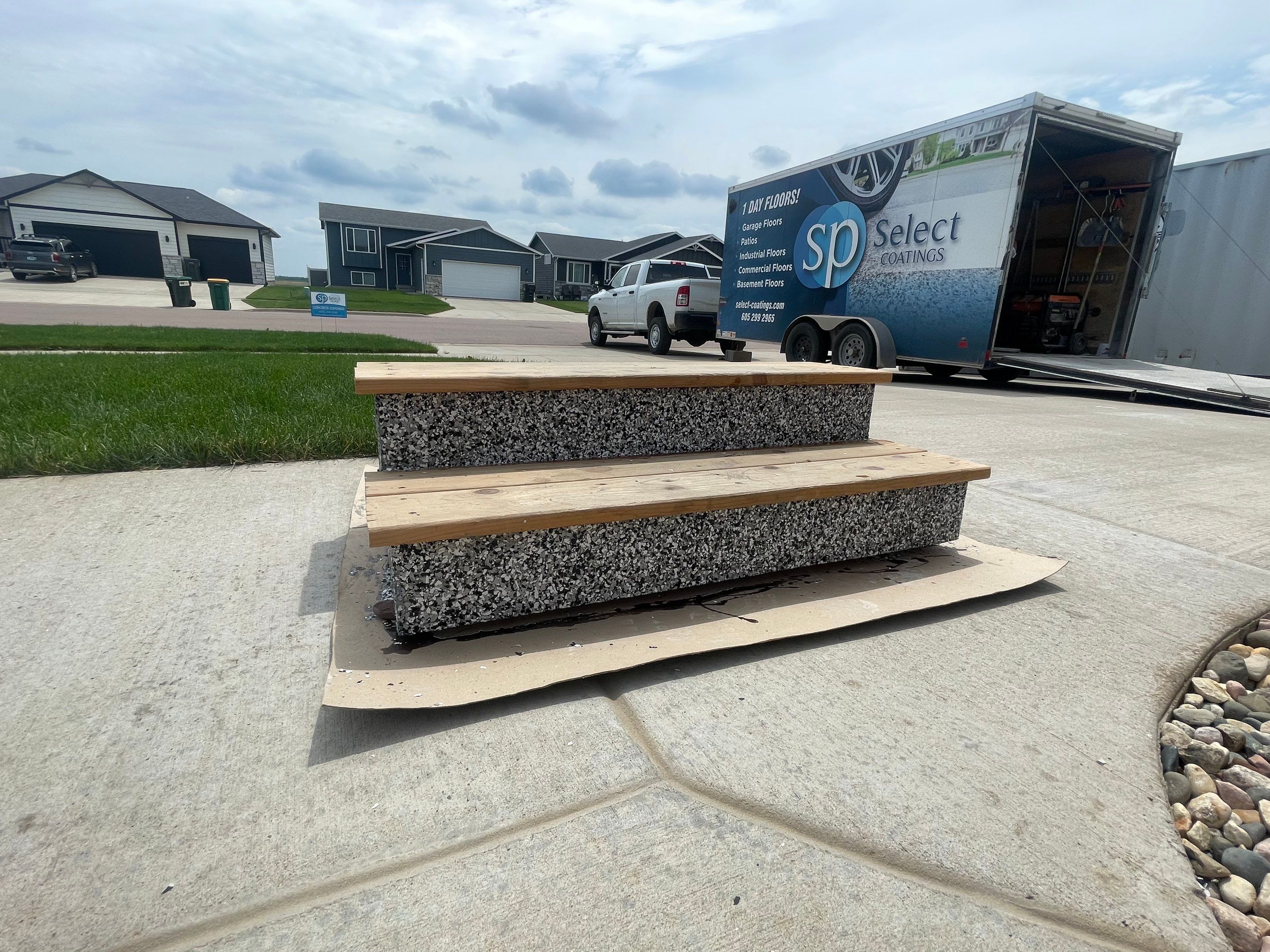 Grey Flake Epoxy Garage Floor Coating in Sioux Falls by Select Painting, Coatings & Garage Cabinets
