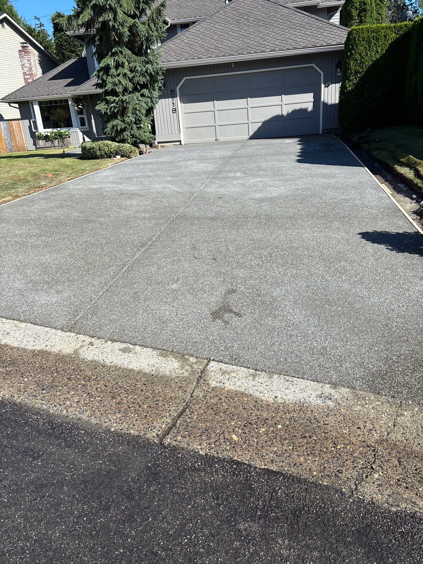 Exposed Aggregate Concrete Driveway Makeover  by Jireh Asphalt & Concrete Inc 