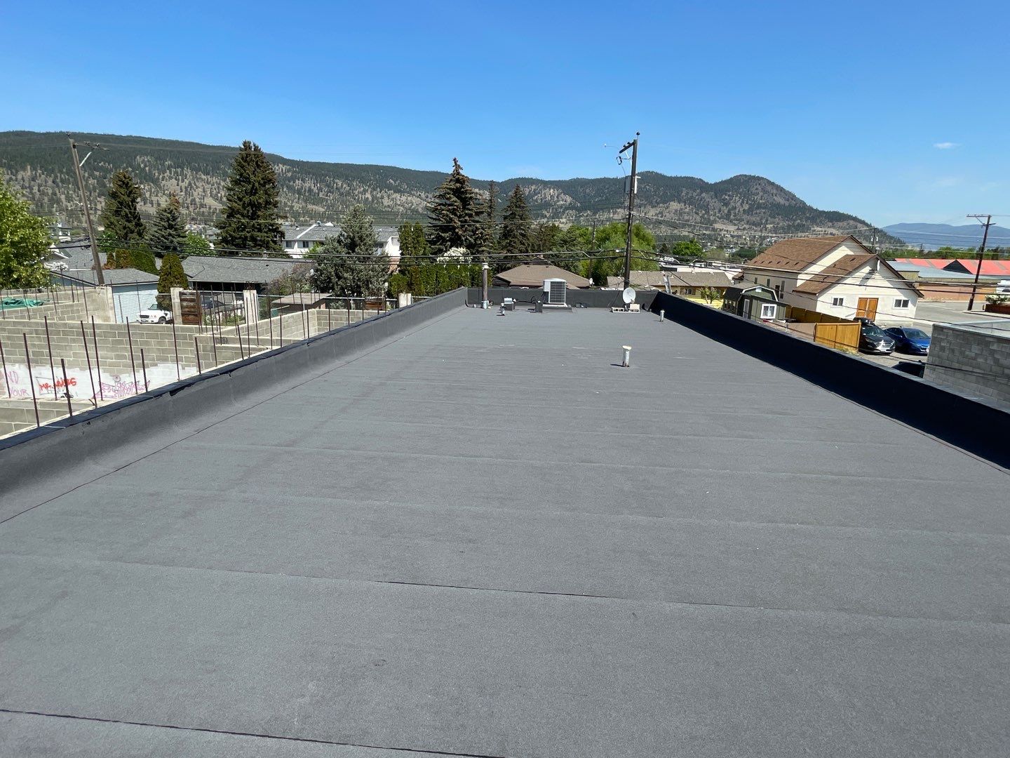 Commercial ReRoofing Installation using IKO 2ply sbs by Top Notch Roofing Inc