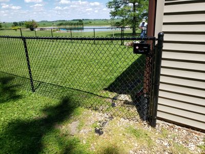 Residential Black Vinyl-Coated Chain Link Fence Installation in Bristow