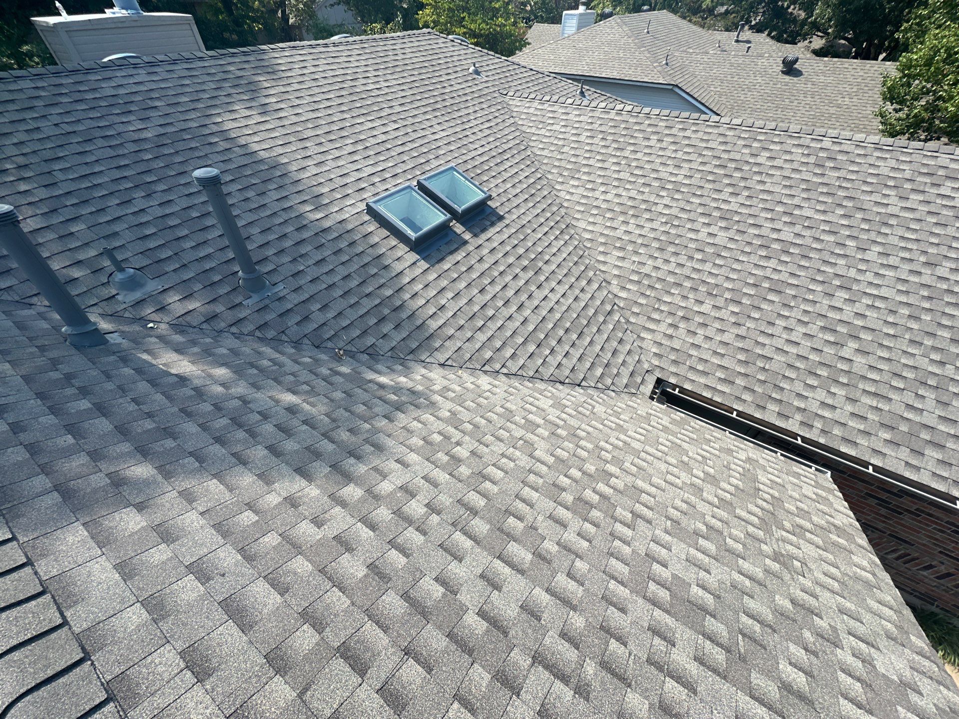 roof replacement and skylight replacement in Edmond by McCann's Roofing and Construction