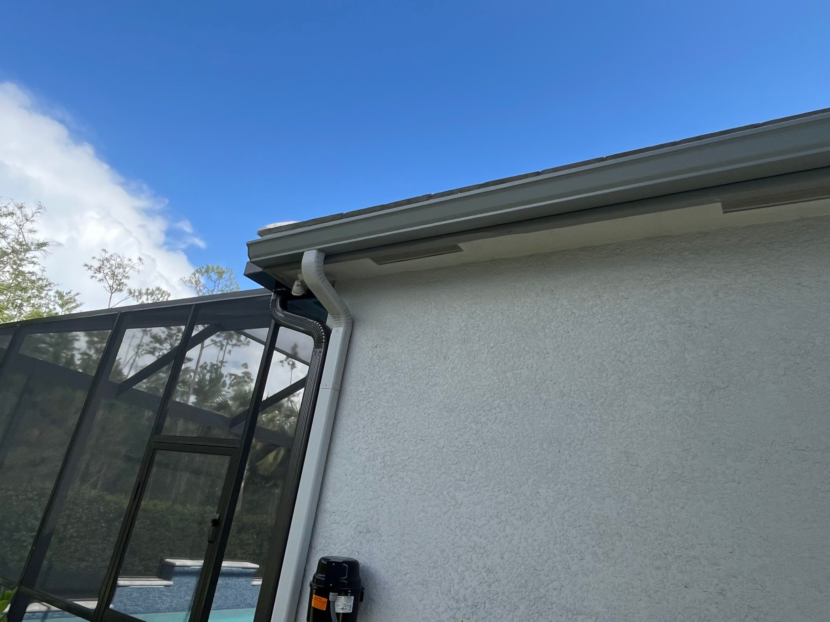 Grey Seamless Gutter Installation in Estero FL by Gutter Professors