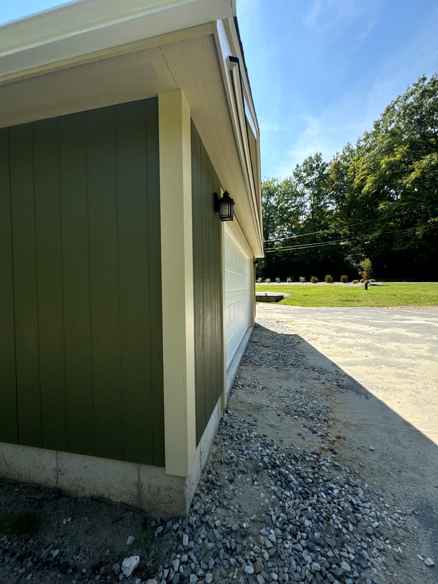 Two-Car Garage using LP SmartSide Panel Siding by Chagnon Building & Remodeling LLC