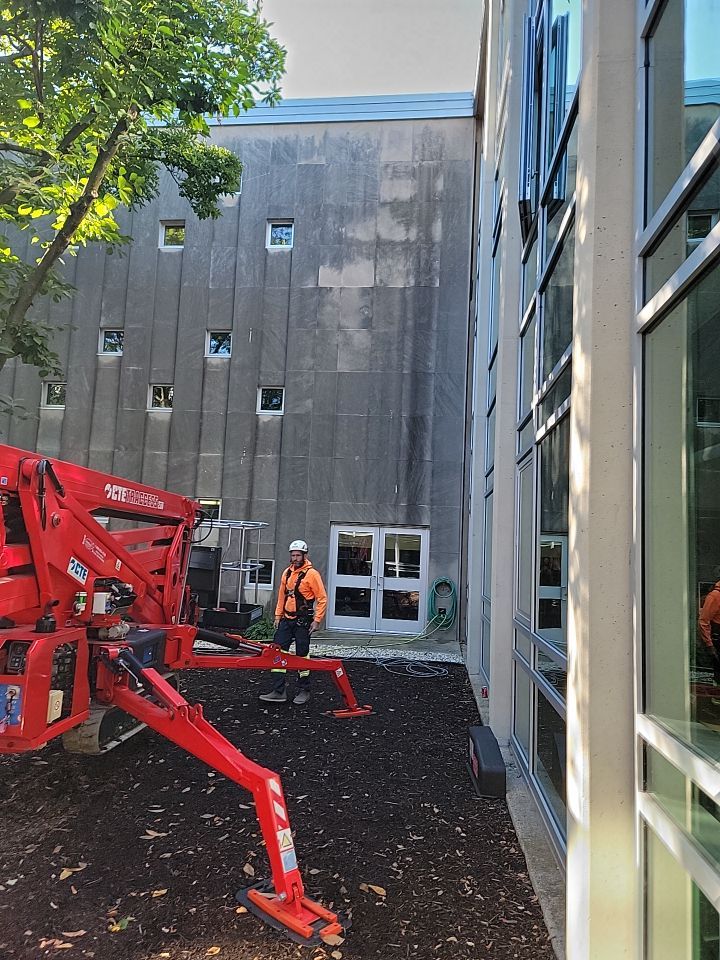 Courtyard pressure washing difficult access.  by Northern Power Washing LLC.