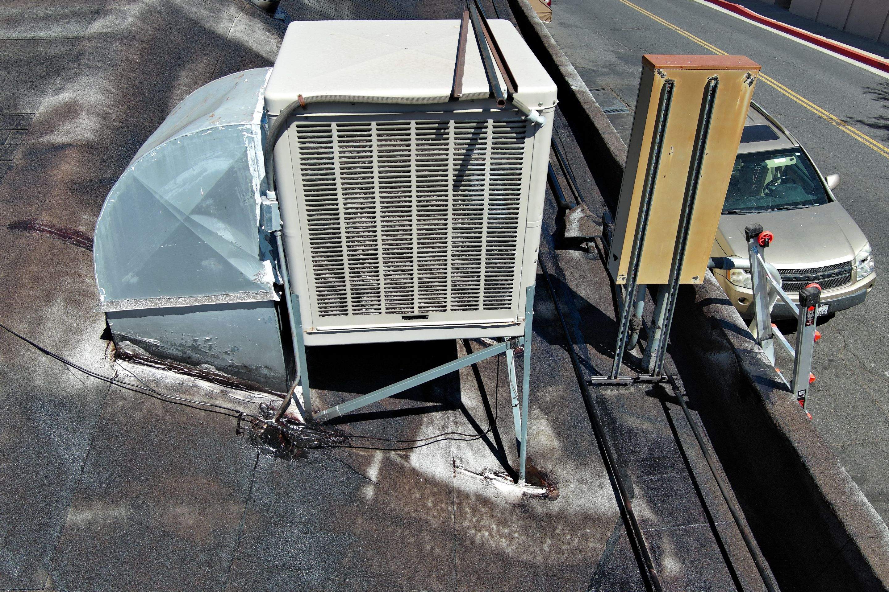 Foam and coatings on commercial roof by Straight Edge Roofing Inc