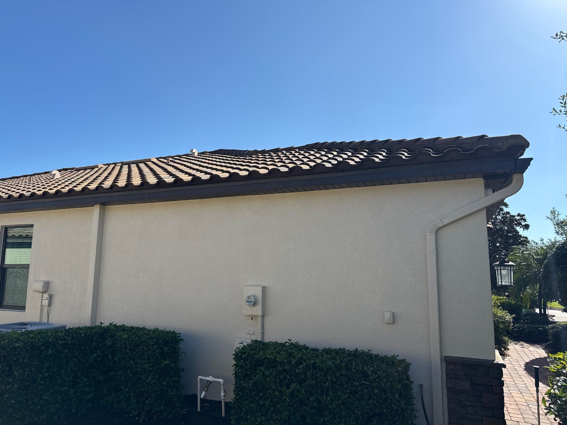 Barrel Tile Roof Cleaning & Paver Driveway Cleaning in River Strand at Heritage Harbour | Bradenton, FL by Sunshine AquaWash