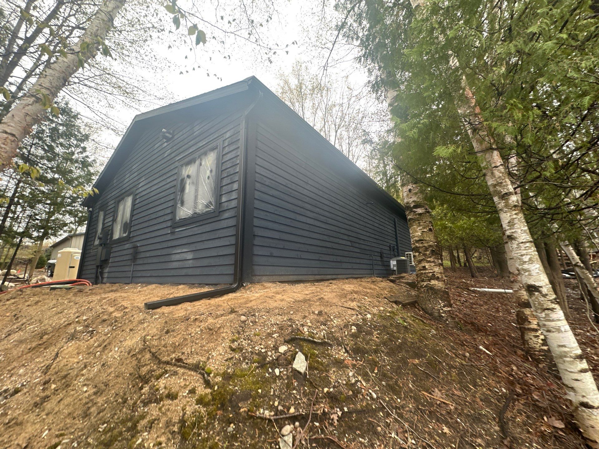 Gutter and Gutter Helmet Installation for Kewadin Residence by Rainbow Seamless Systems