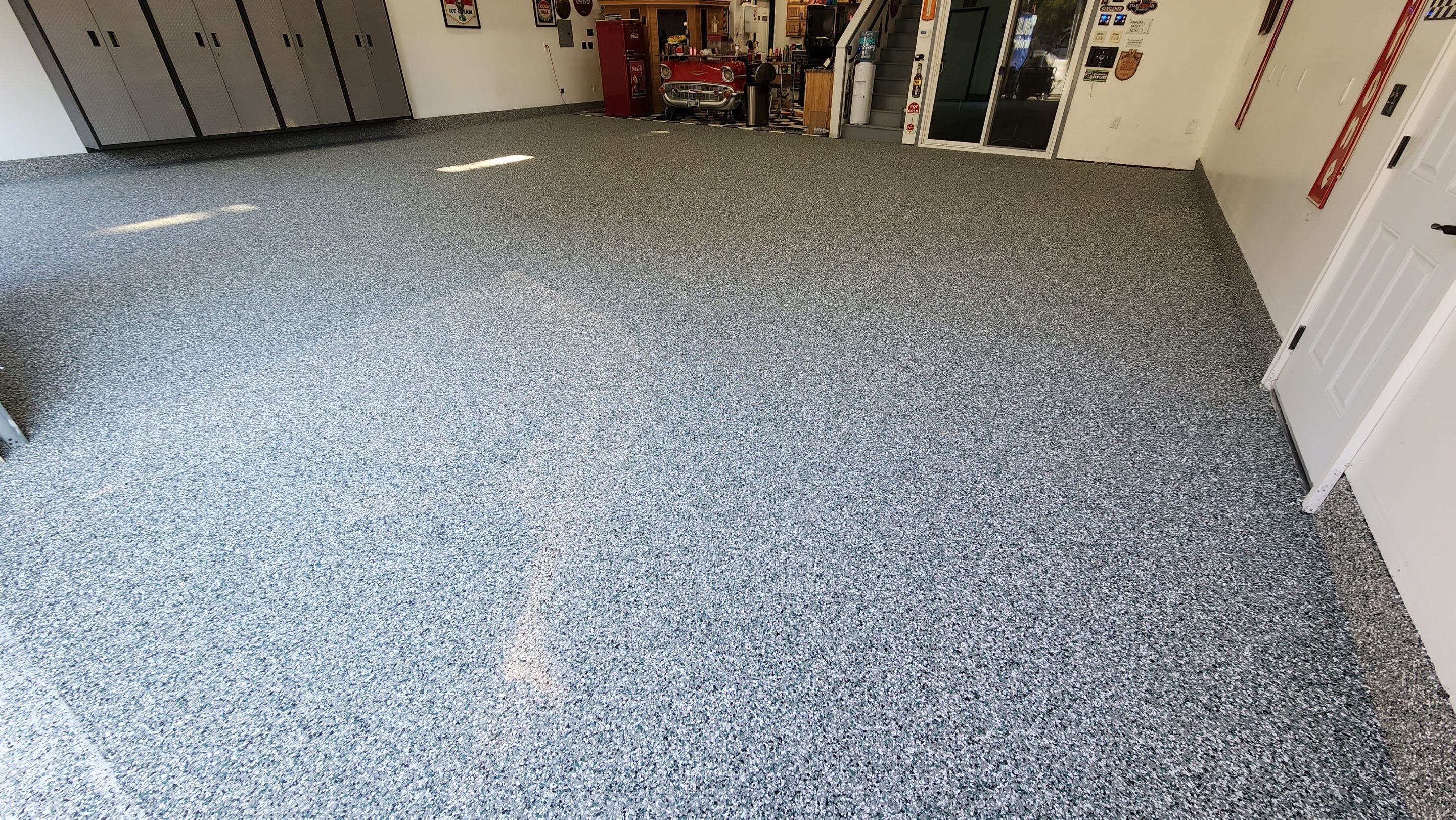 Garage Transformation using Domino with Blue by Croc Coatings, LLC