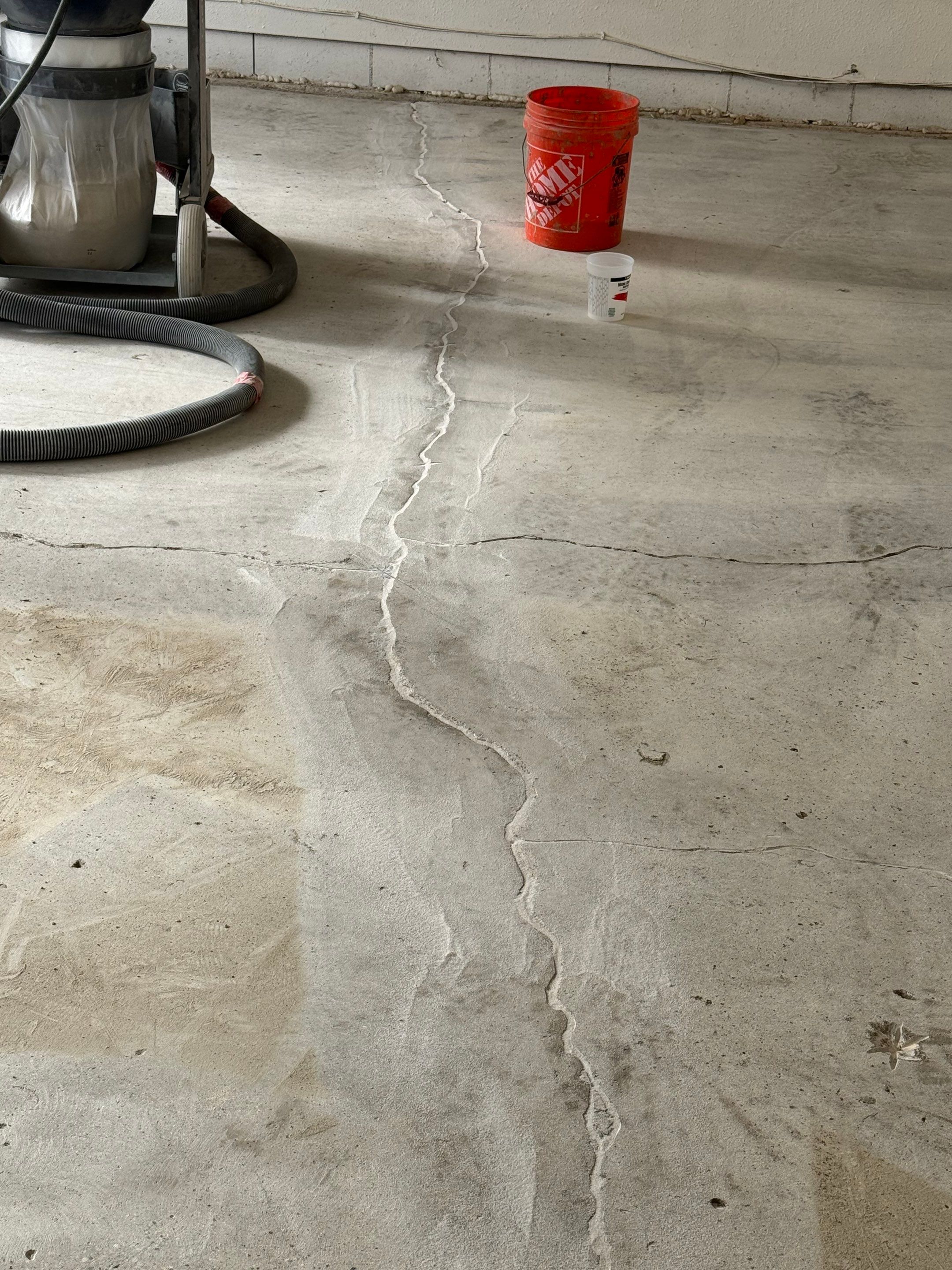 Feather Grey Garage Floor Coating and Crack Repair in Beresford by Select Painting, Coatings & Garage Cabinets