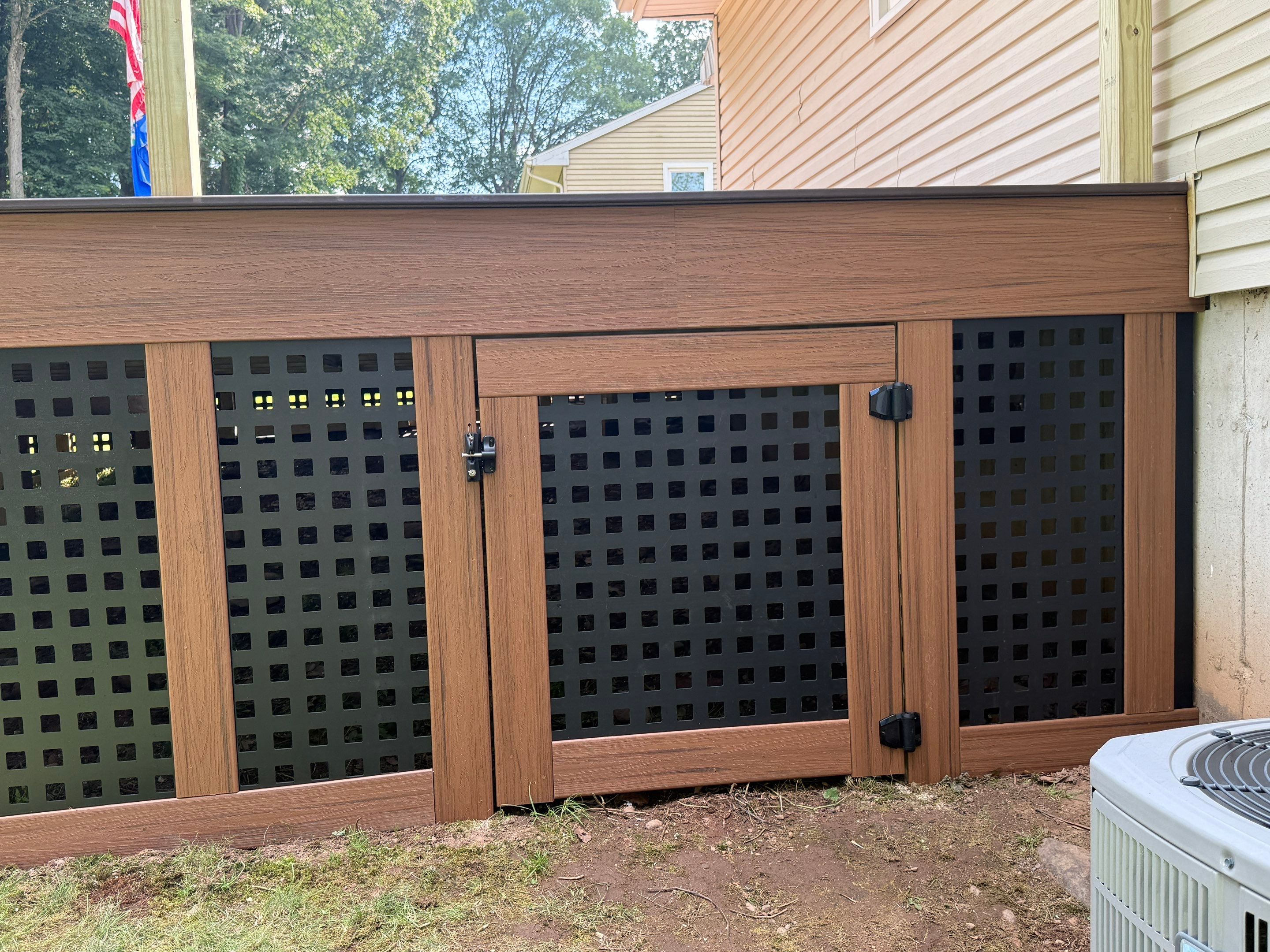 Replacement Deck, Trex Tropical Tiki torch , Matching Fascia. Black Transcend railing and Lattice. by DiGiorgi Roofing and Siding Inc