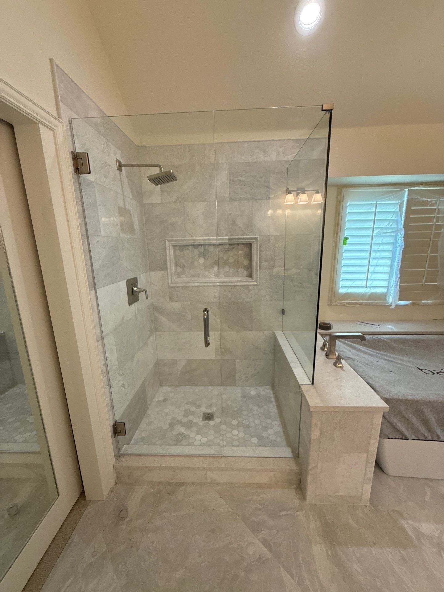 Frameless Shower and Mirror for Closet Applied to Pocket Door by Richardson Glass & Mirror