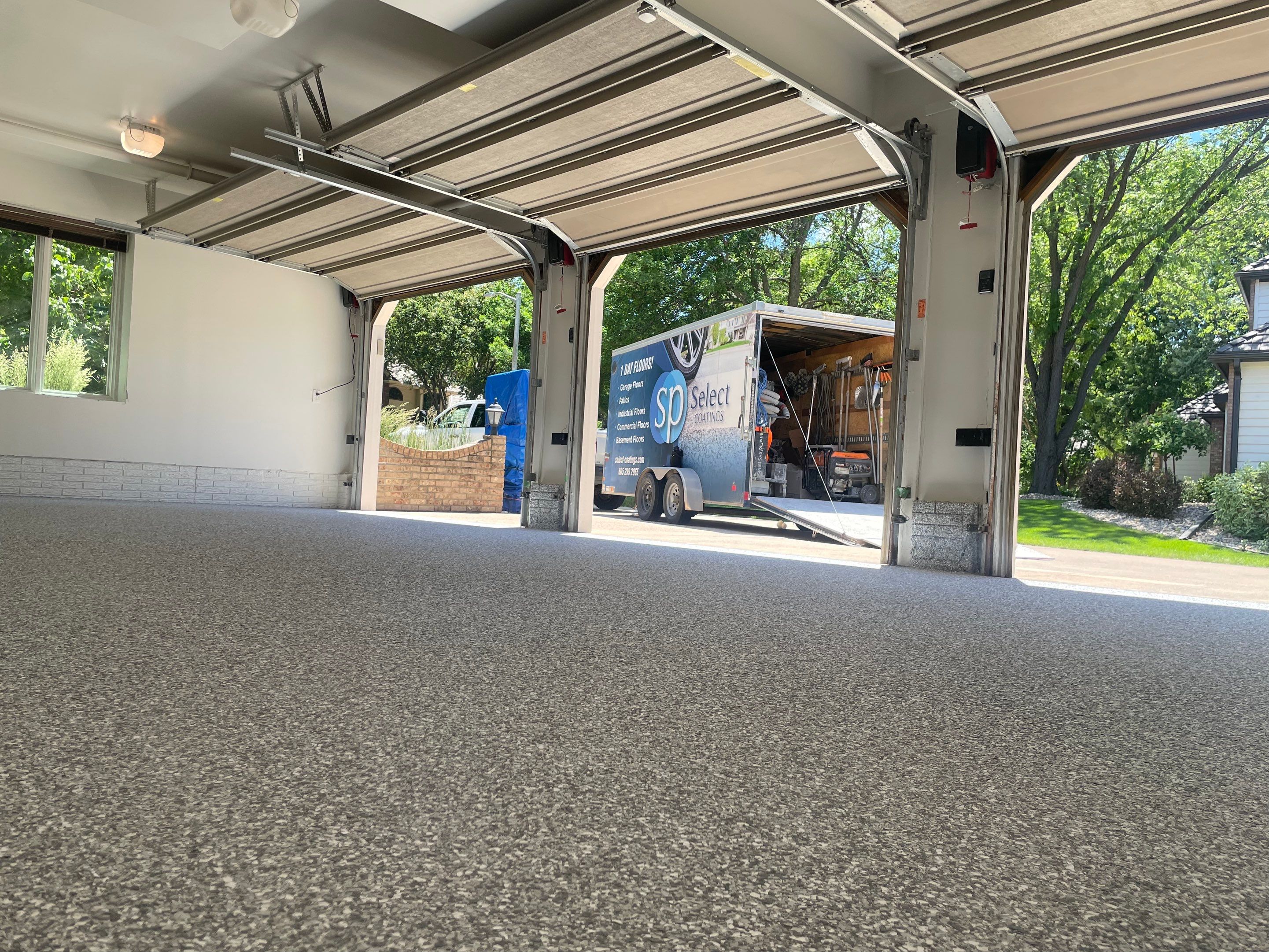 Gray Speckled Epoxy Garage Floor Coating in Sioux Falls by Select Painting, Coatings & Garage Cabinets