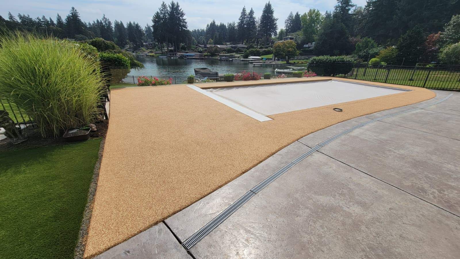 Pool Deck with Rubber Stone Finish by Concrete Coating Experts Inc.