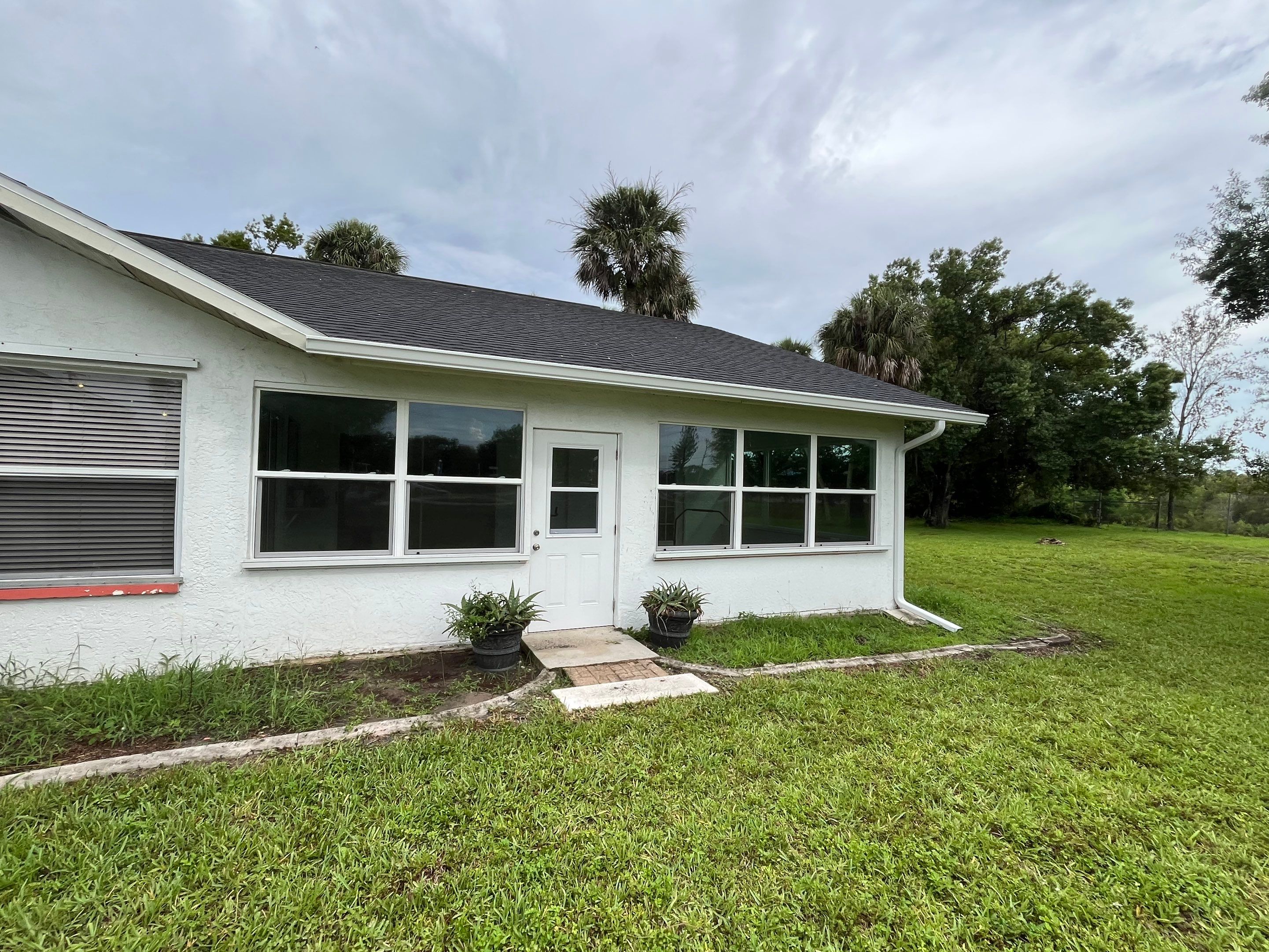 White Seamless Gutters with Splash Guards in North Fort Myers FL by Gutter Professor   by Gutter Professors