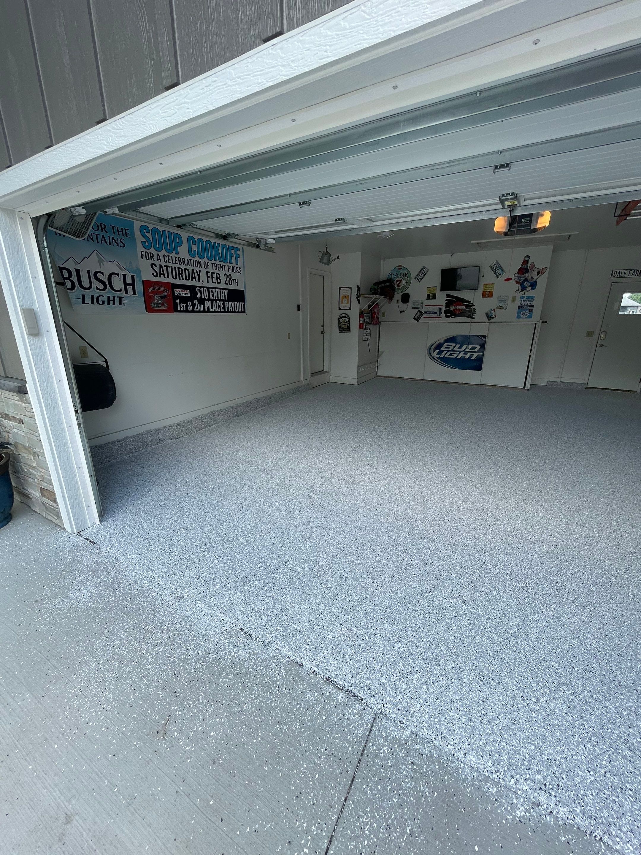 Residential Garage Floor Coating with Feather Grey Finish in Sioux Falls by Select Painting, Coatings & Garage Cabinets