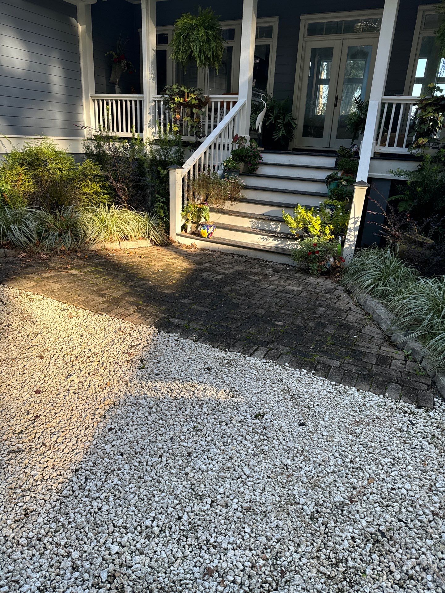 Concrete Driveway and Patio Installation With Decorative Brick Borders by Lowcountry Scapes, LLC