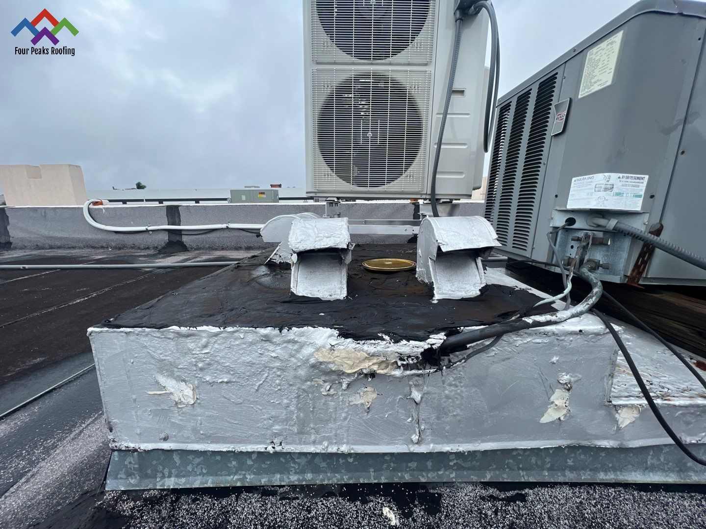 Commercial Roofing Repair using Roof Sealant by Four Peaks Roofing