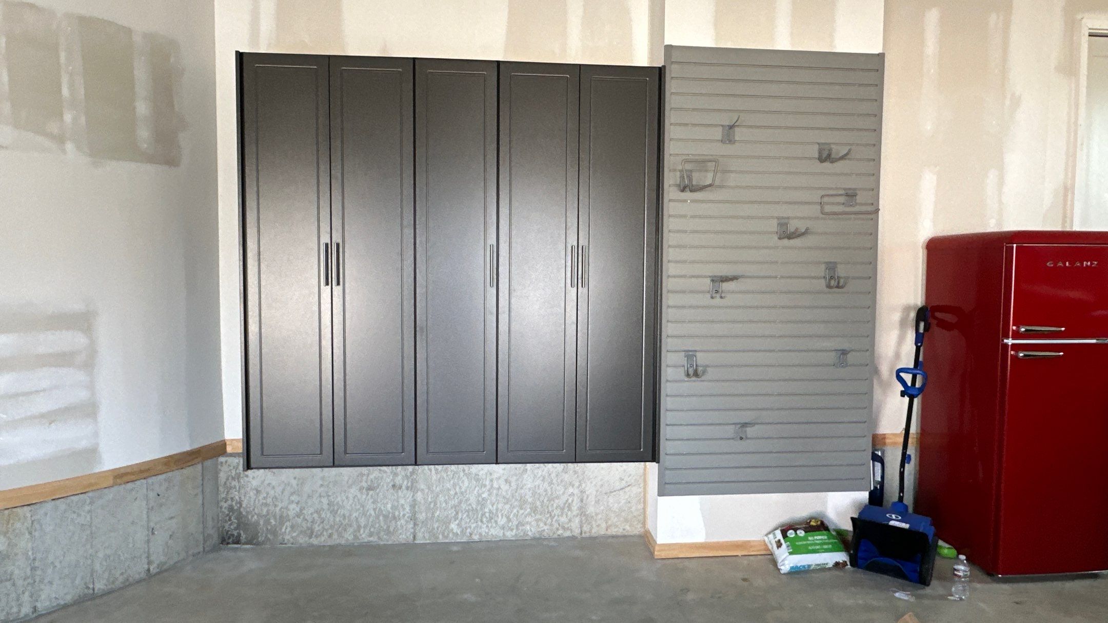 Megan J. added cabinets and slotwall to her garage. Plus a New Floor by Banner Garage