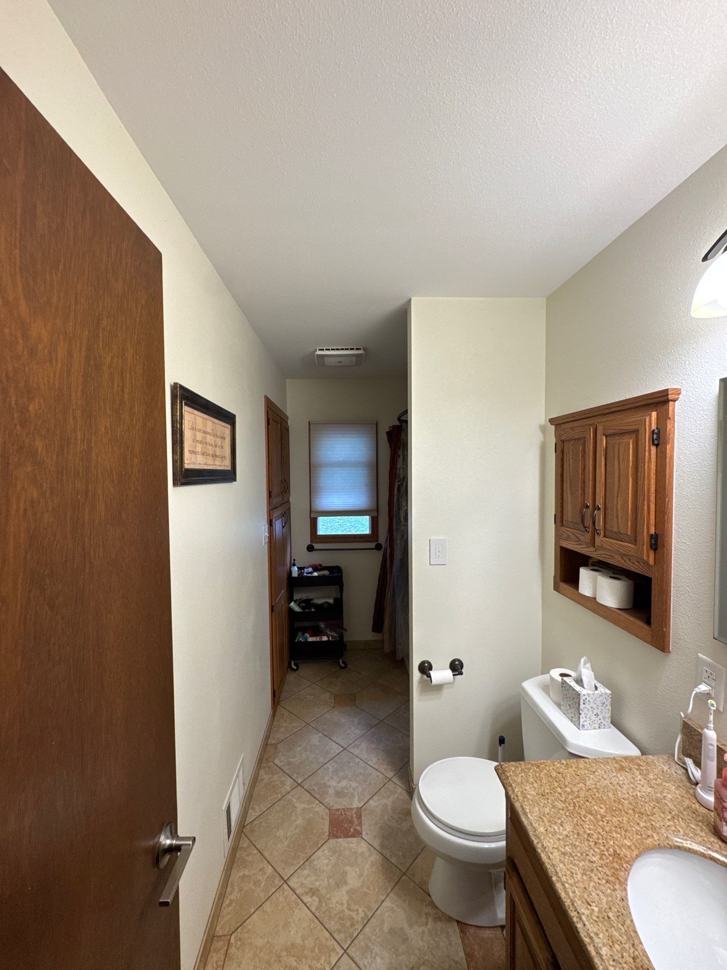 Bathroom Remodel Featuring Stone Tile and Granite Vanity in Mukwonago by OCS Contracting Services