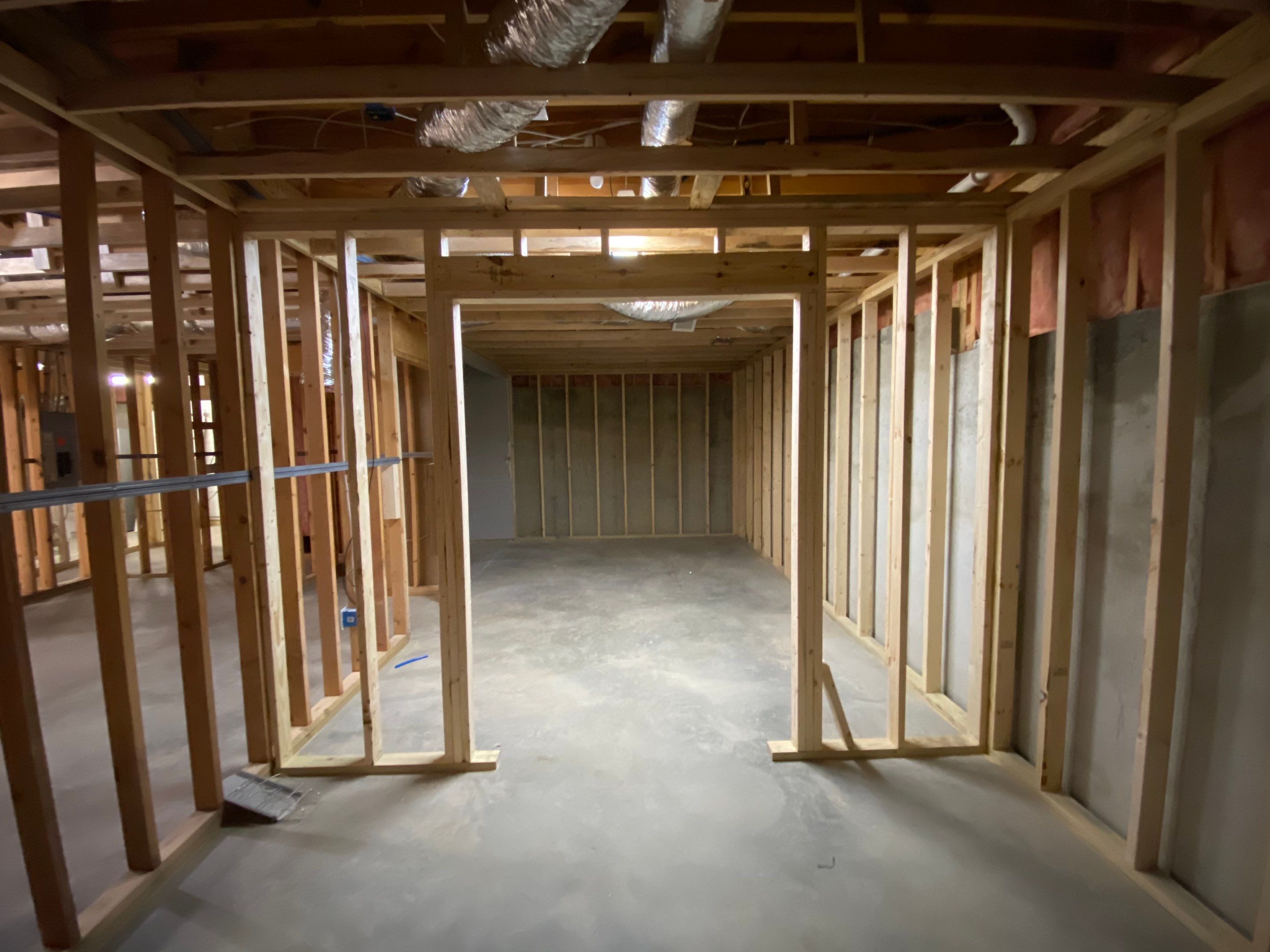 Acworth Basement Transformation With Wet Bar and Stone Fireplace by Swift Home Renovations