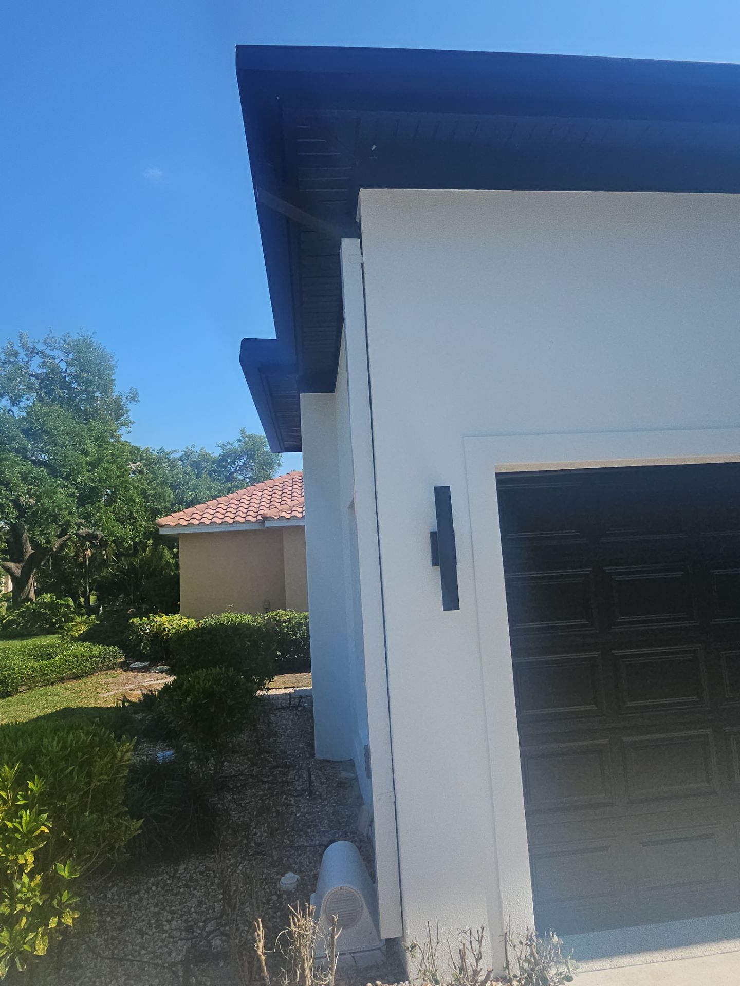Soffit and Fascia Installation and black seamless gutters in Sarasota FL by Gutter Professors