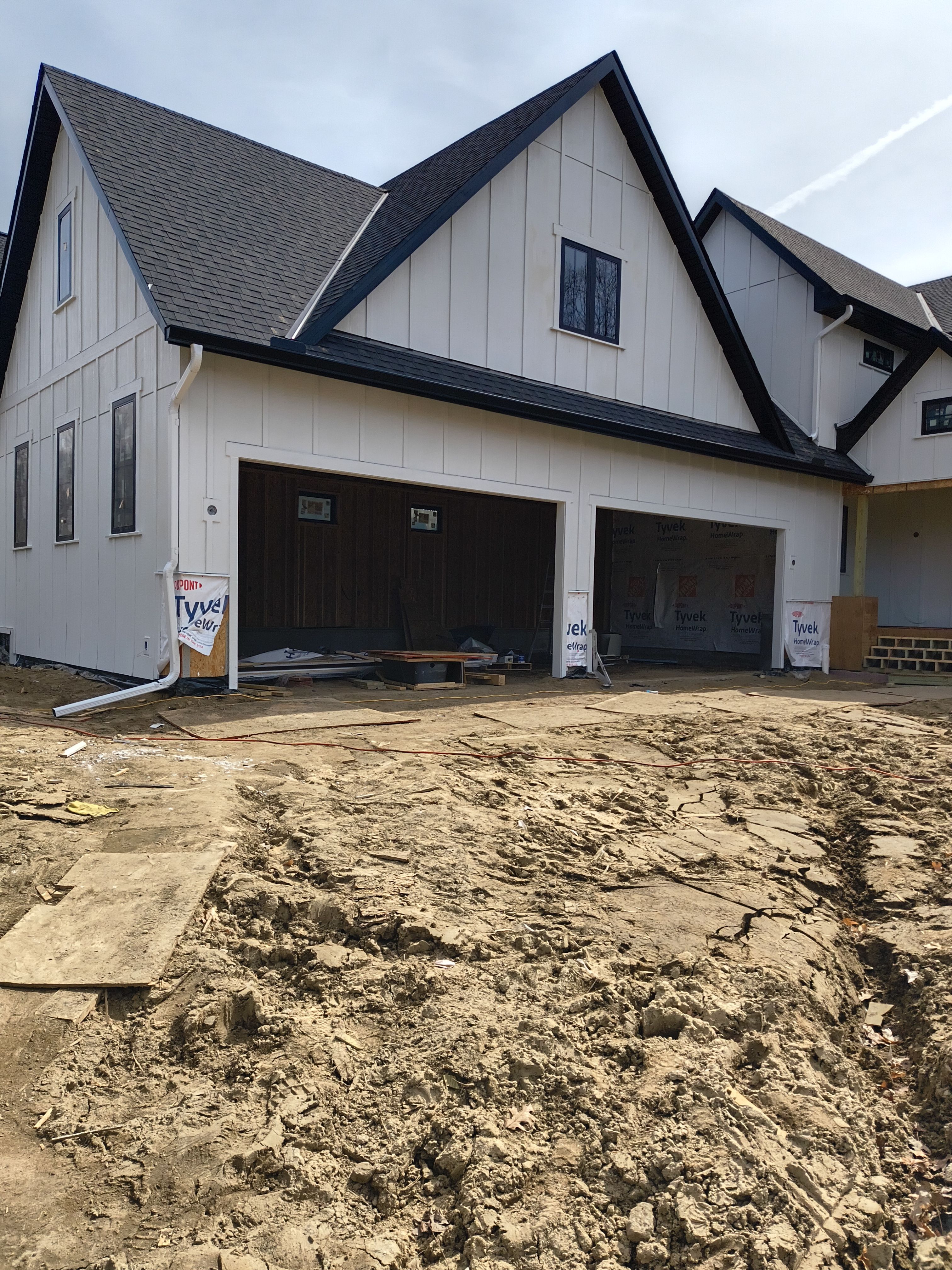 Black Seamless Gutter Installation for New Excelsior Home Build by Next Level Seamless Gutters / Exteriors Inc.