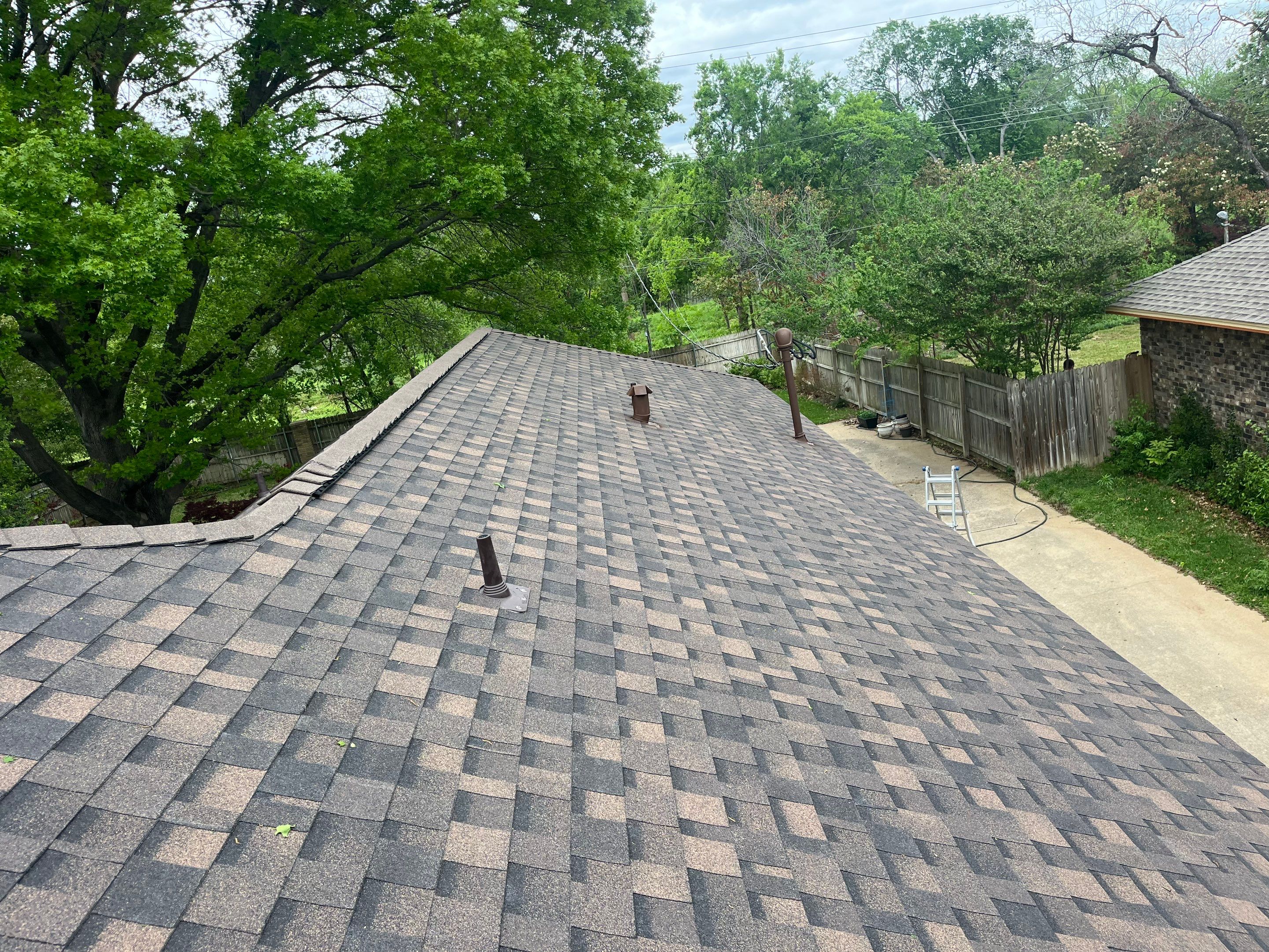 Brown brick with IKO Shadow Brown by Tejas Roofworks + Restoration