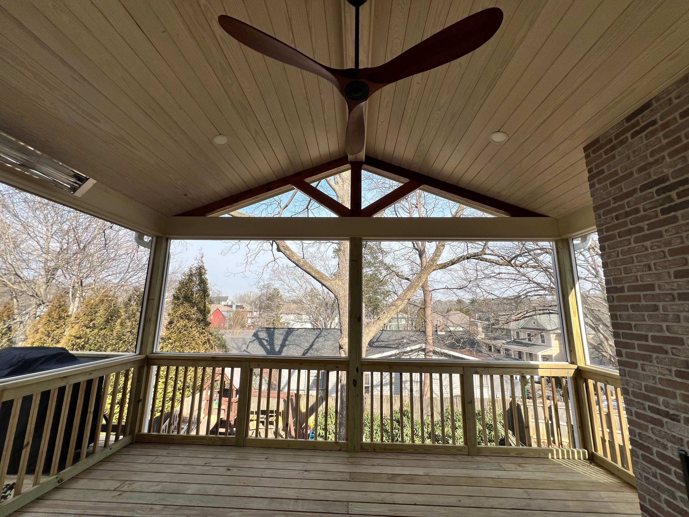 Screened-In Porch With Fireplace by Swift Home Renovations 