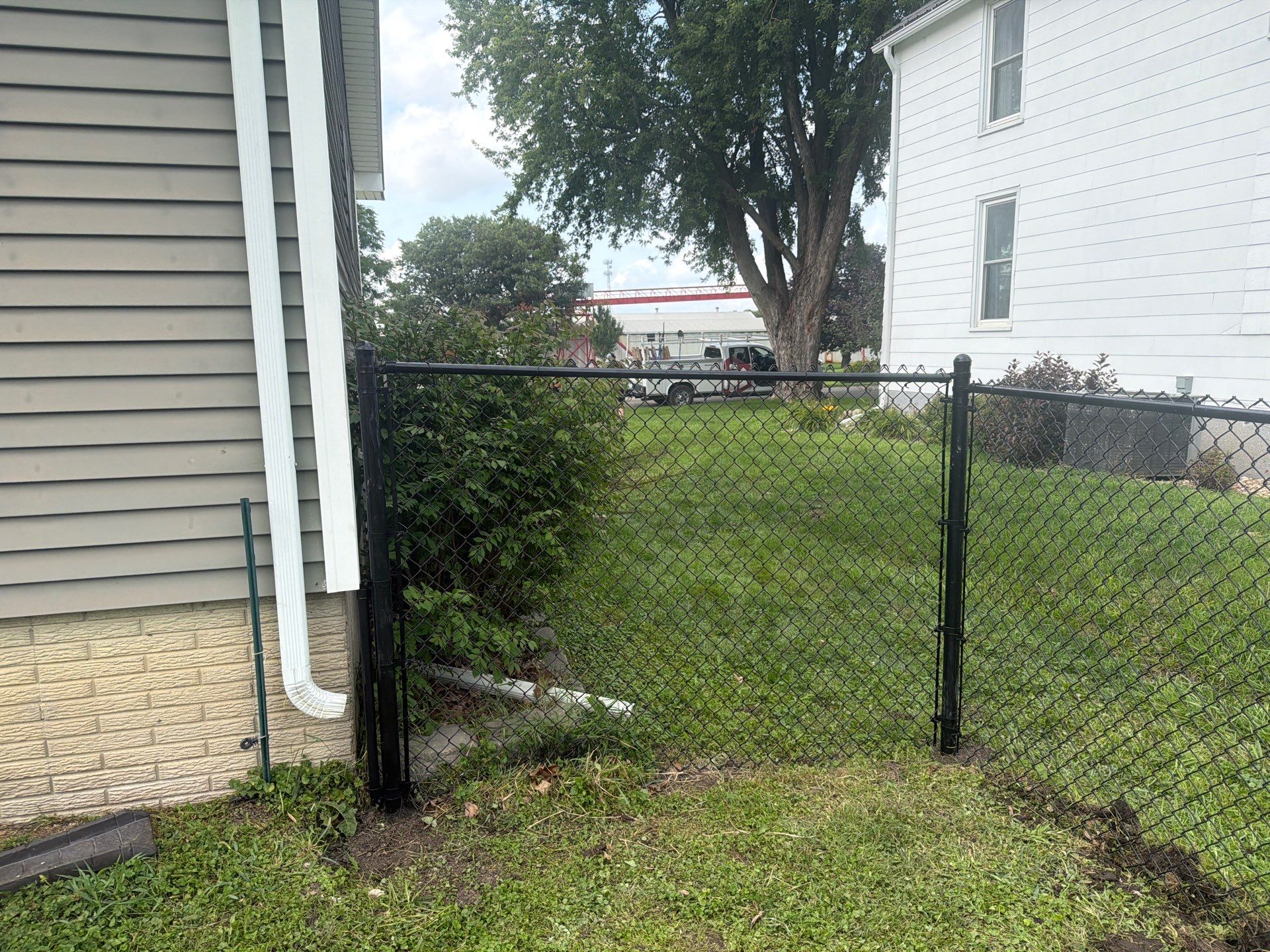 Residential Black Chain Link Fence Installation in Reinbeck by Perfect Picket Fence and Stain