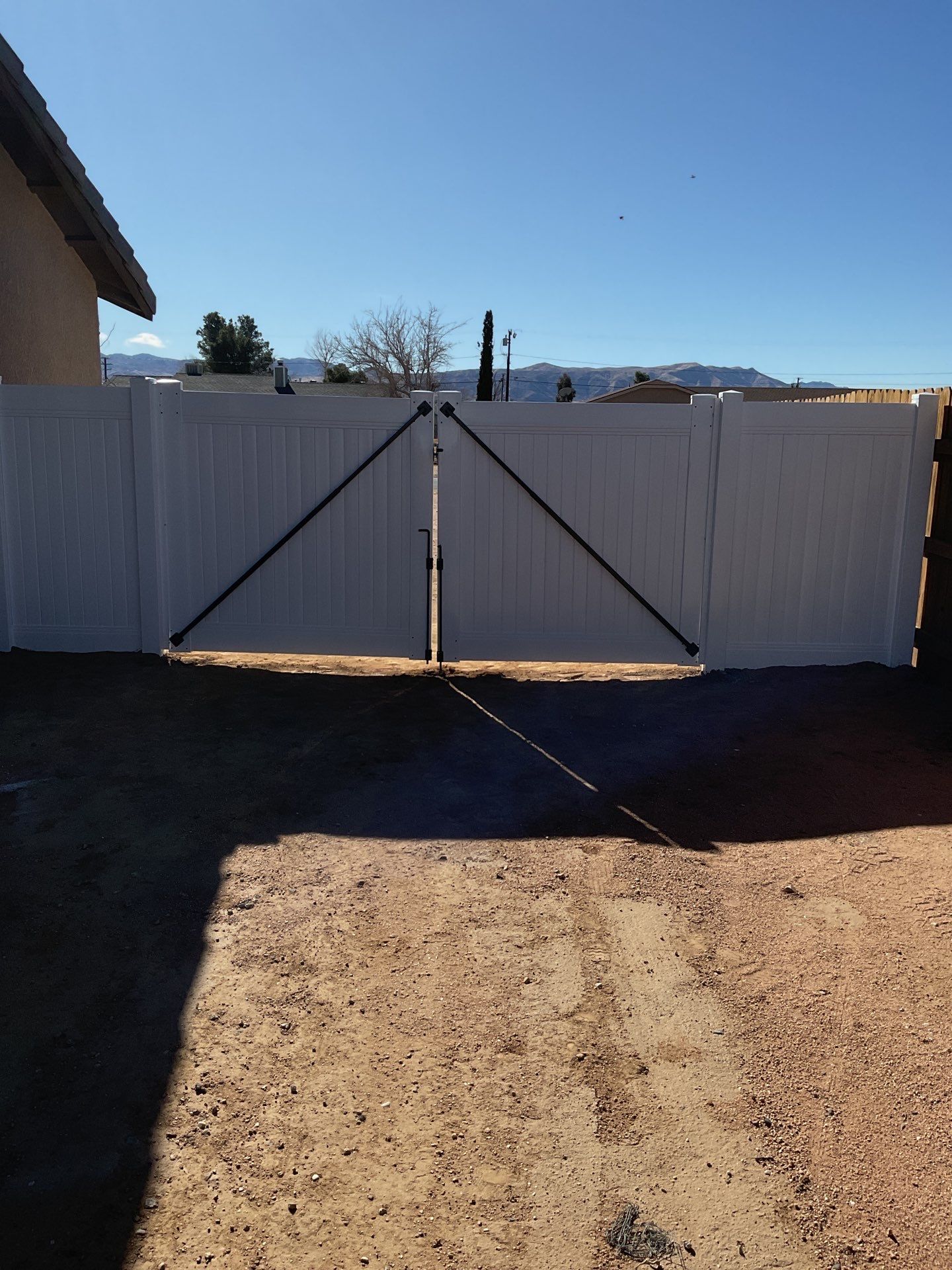 Gate installation using Vinyl by Fence Guys Inc. 