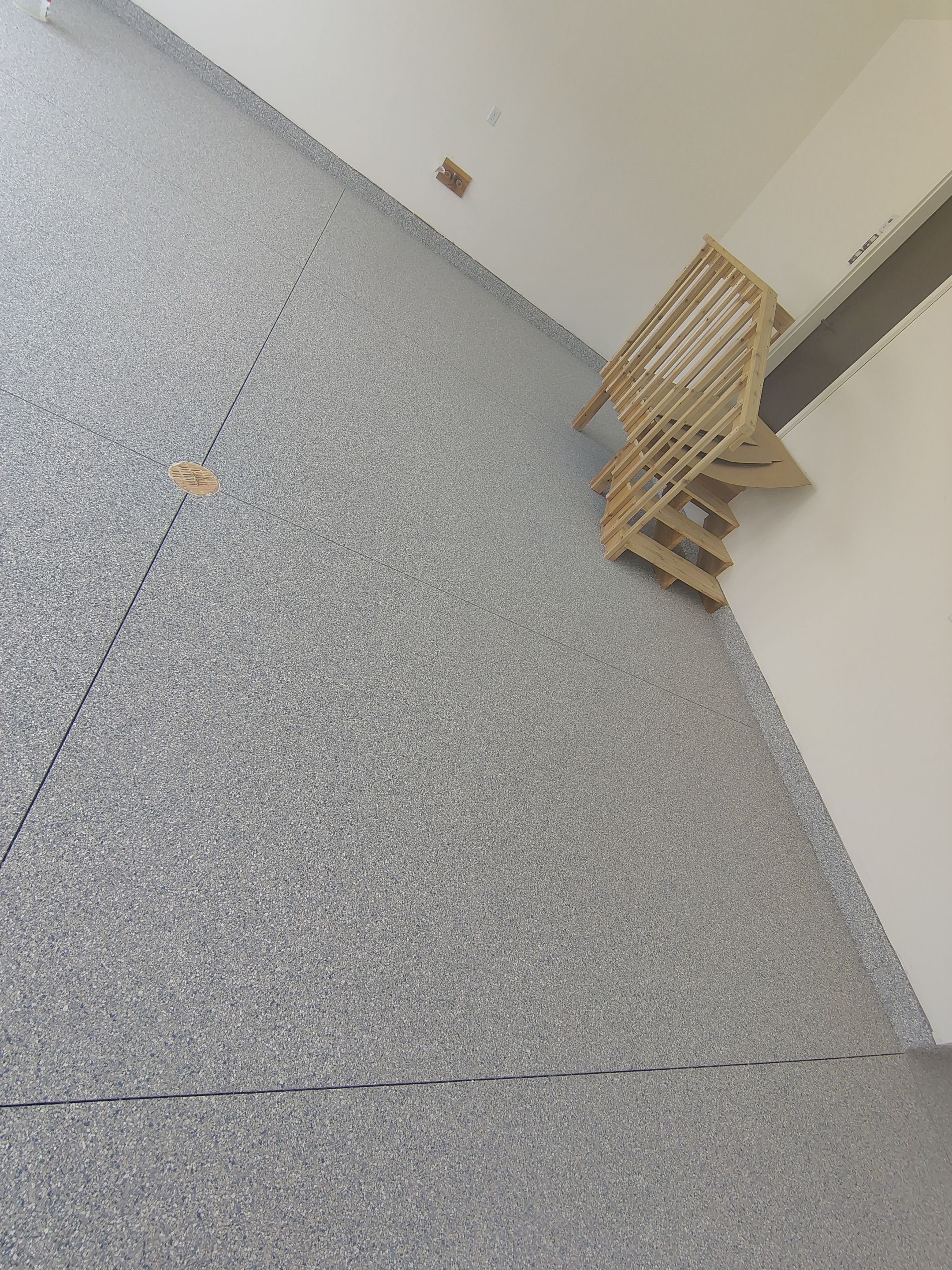 Sioux Falls Garage Floor Transformation with Gray Decorative Flake Coating by Select Painting, Coatings & Garage Cabinets