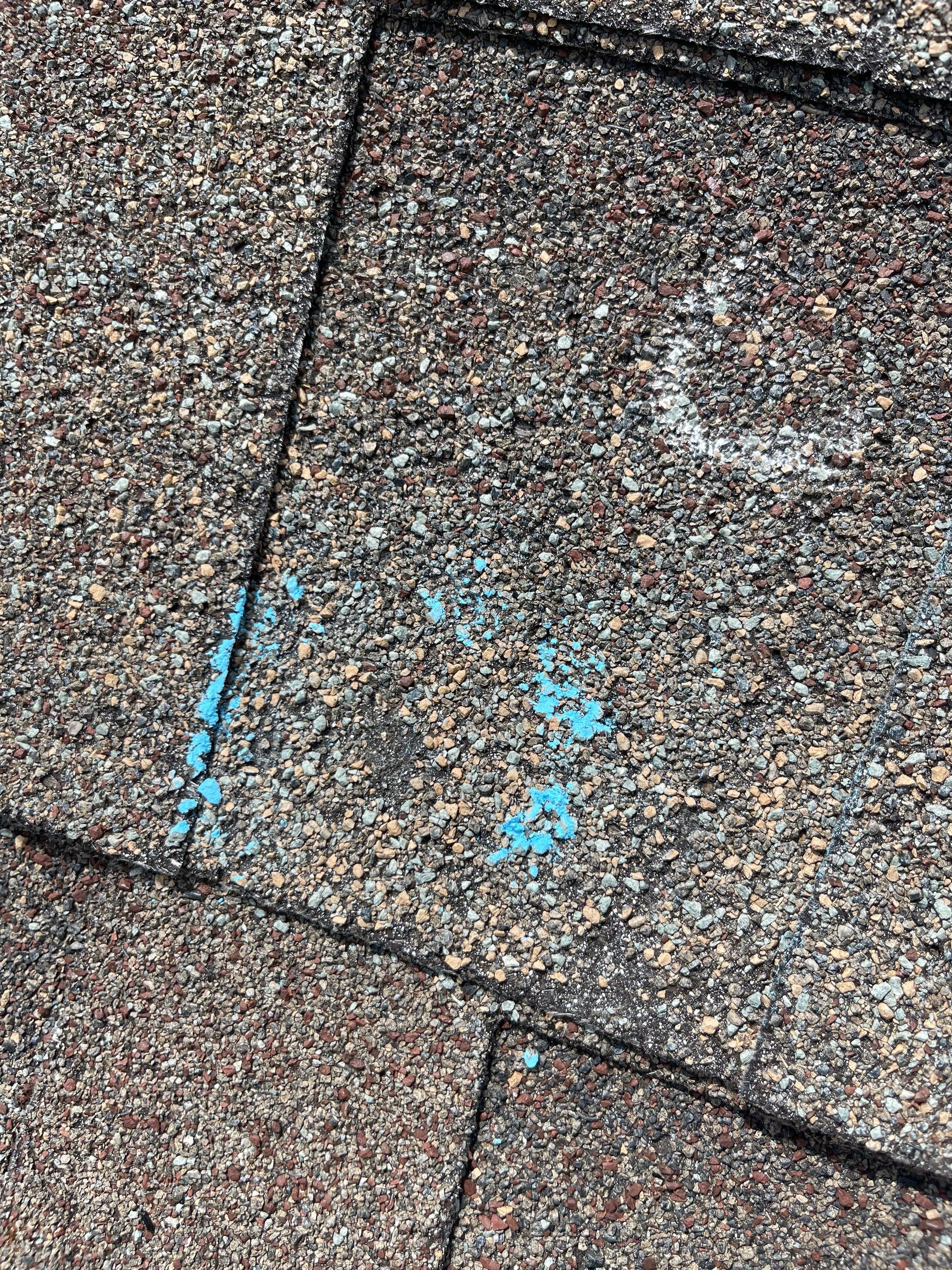 Hail Damage on a Roofing System by Icon Roofing And Construction 